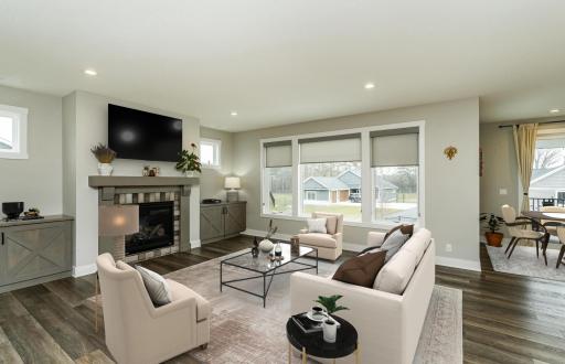 Family room with gas fireplace, transom windows, and storage to both sides