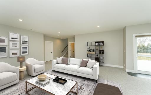 Lower level family room with gas fireplace and walk-out to patio