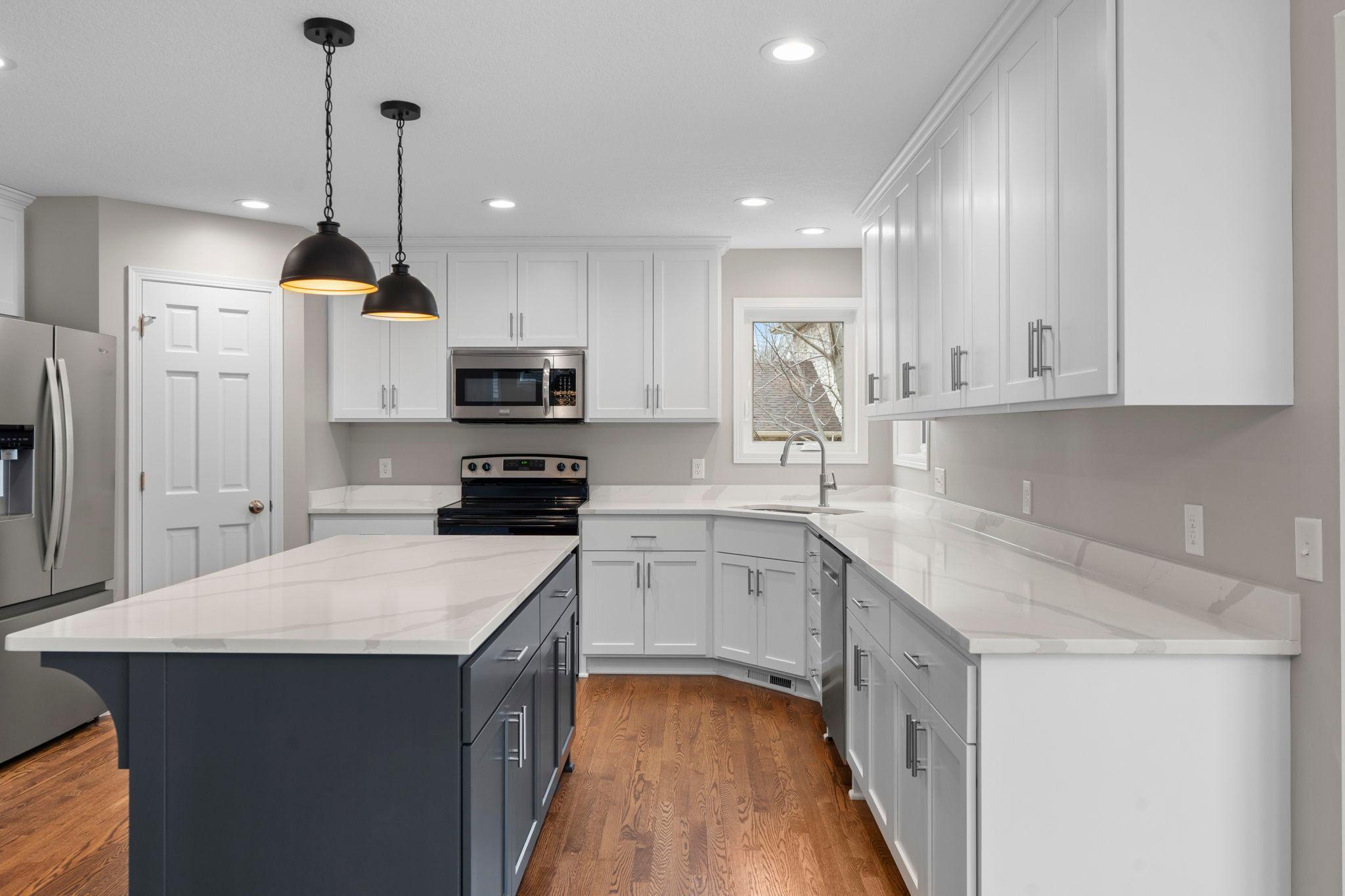 Brand new kitchen! Cabinets, island, and quartz countertops.
