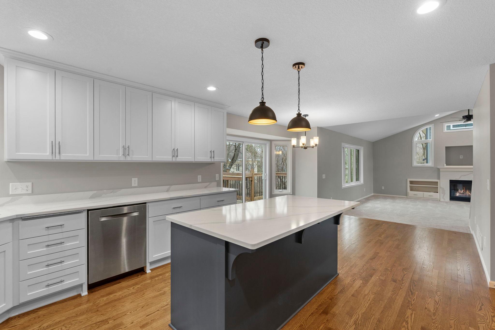 Fantastic open floor plan! Stylish center island with breakfast bar. Elegant quartz countertops. You'll love this open concept with vaulted ceilings.