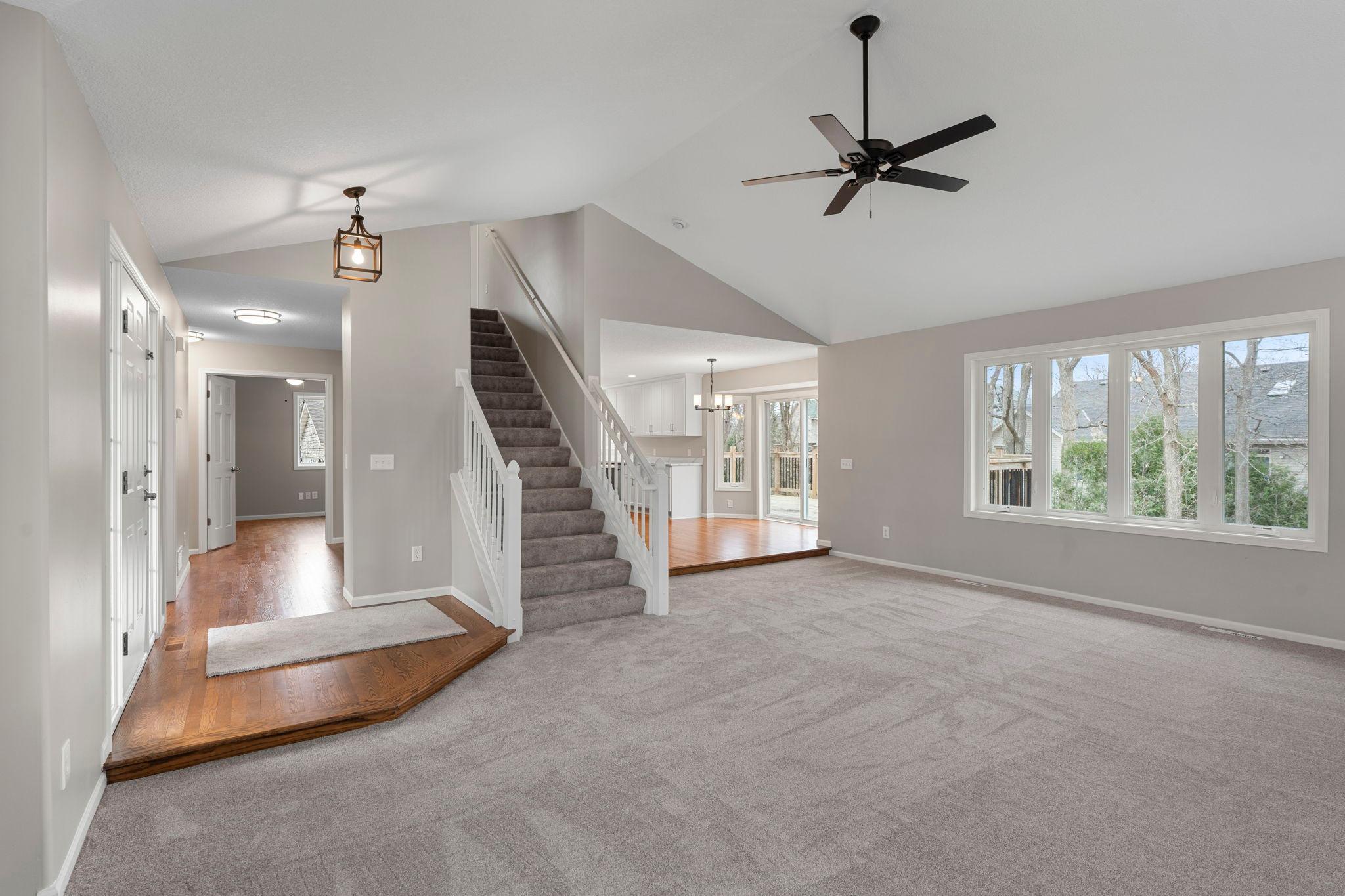 Vaulted ceilings enhance the seamless, open floor plan, creating a warm and welcoming atmosphere.