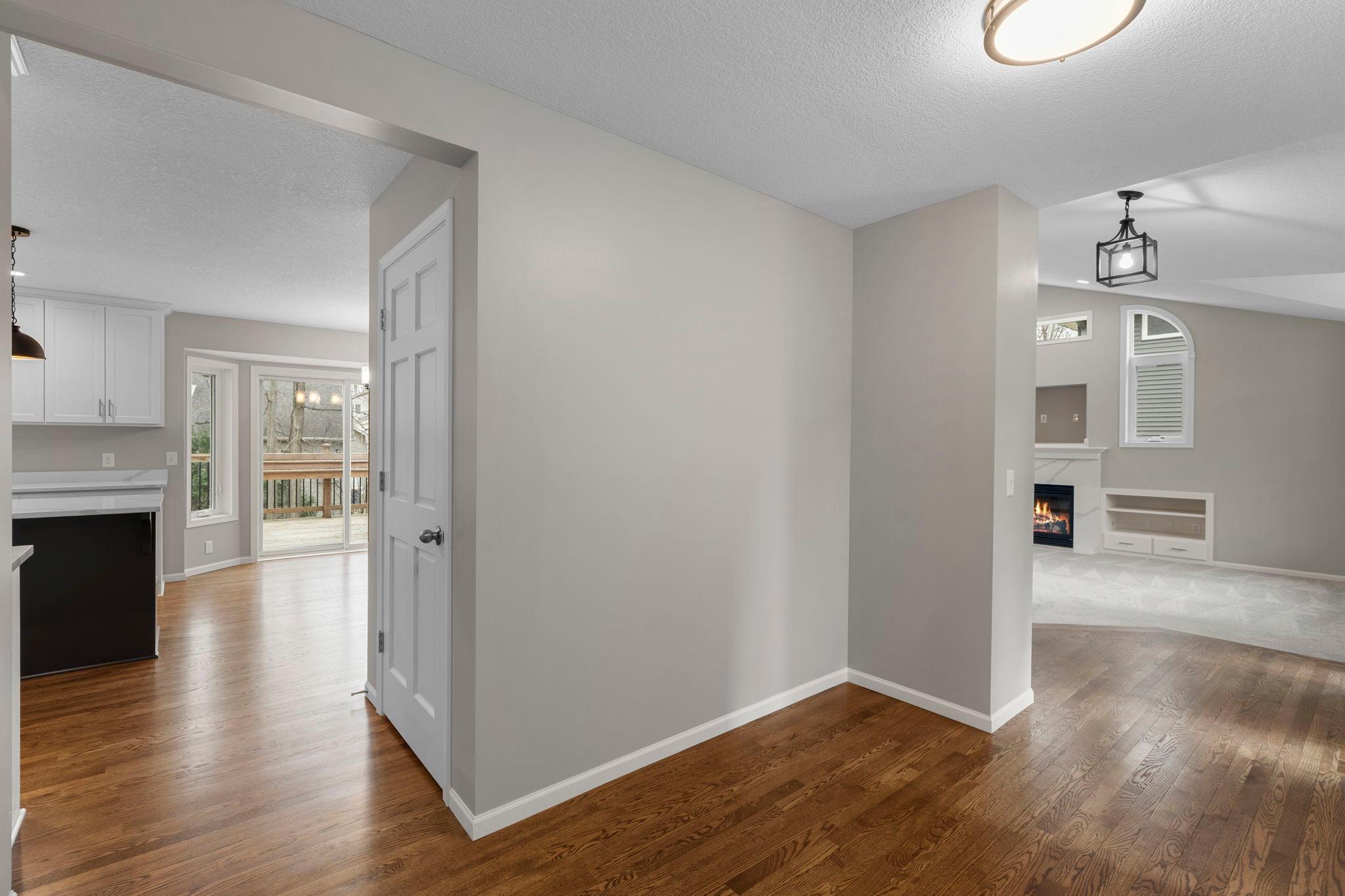 Gorgeous refinished hardwood flooring spans the main level foyer, living, kitchen, and office.