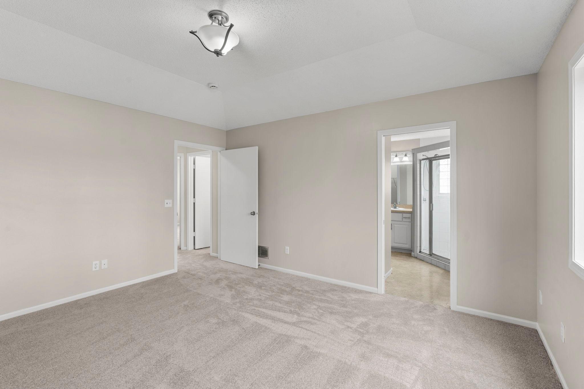 Primary offers it's own private bathroom and walkin closet. Modern white trimwork and doors throughout.