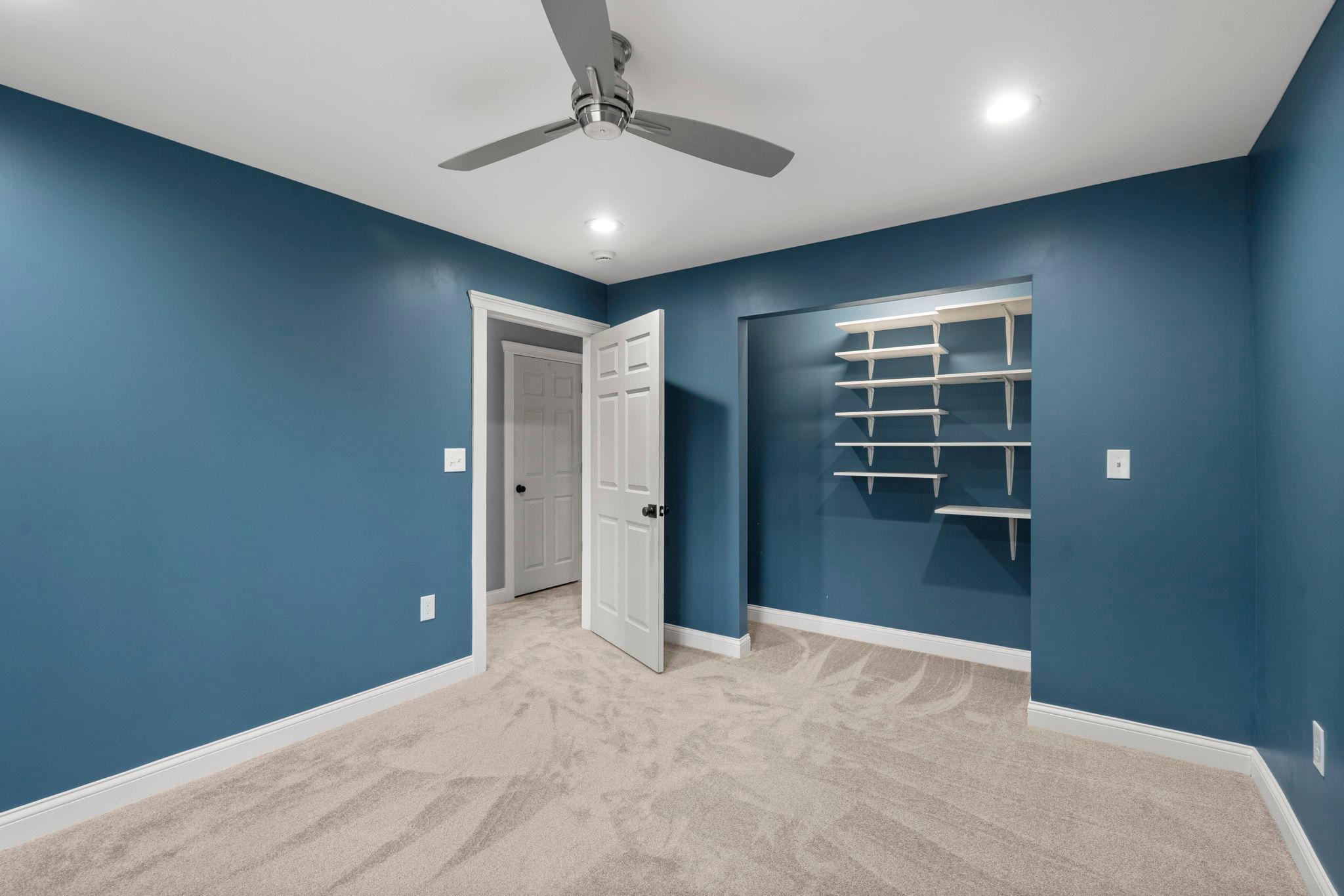 Modern white trim, 6 panel doors, closet organizer and fun pop of color!