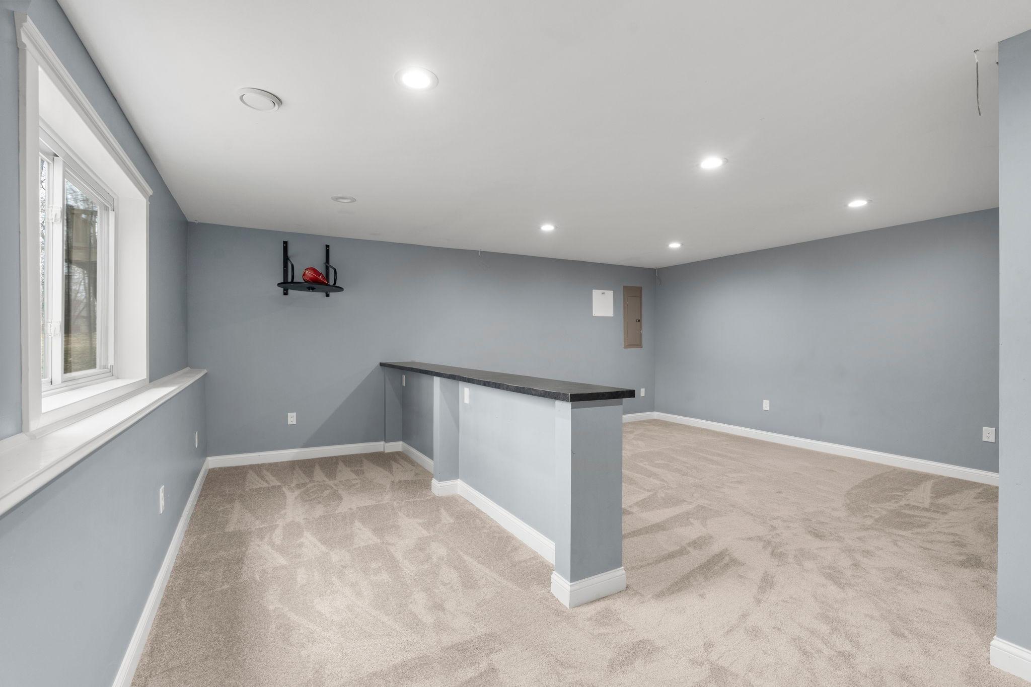 Design to entertain and great flex spaces! Bar seating offers a great entertainment space.