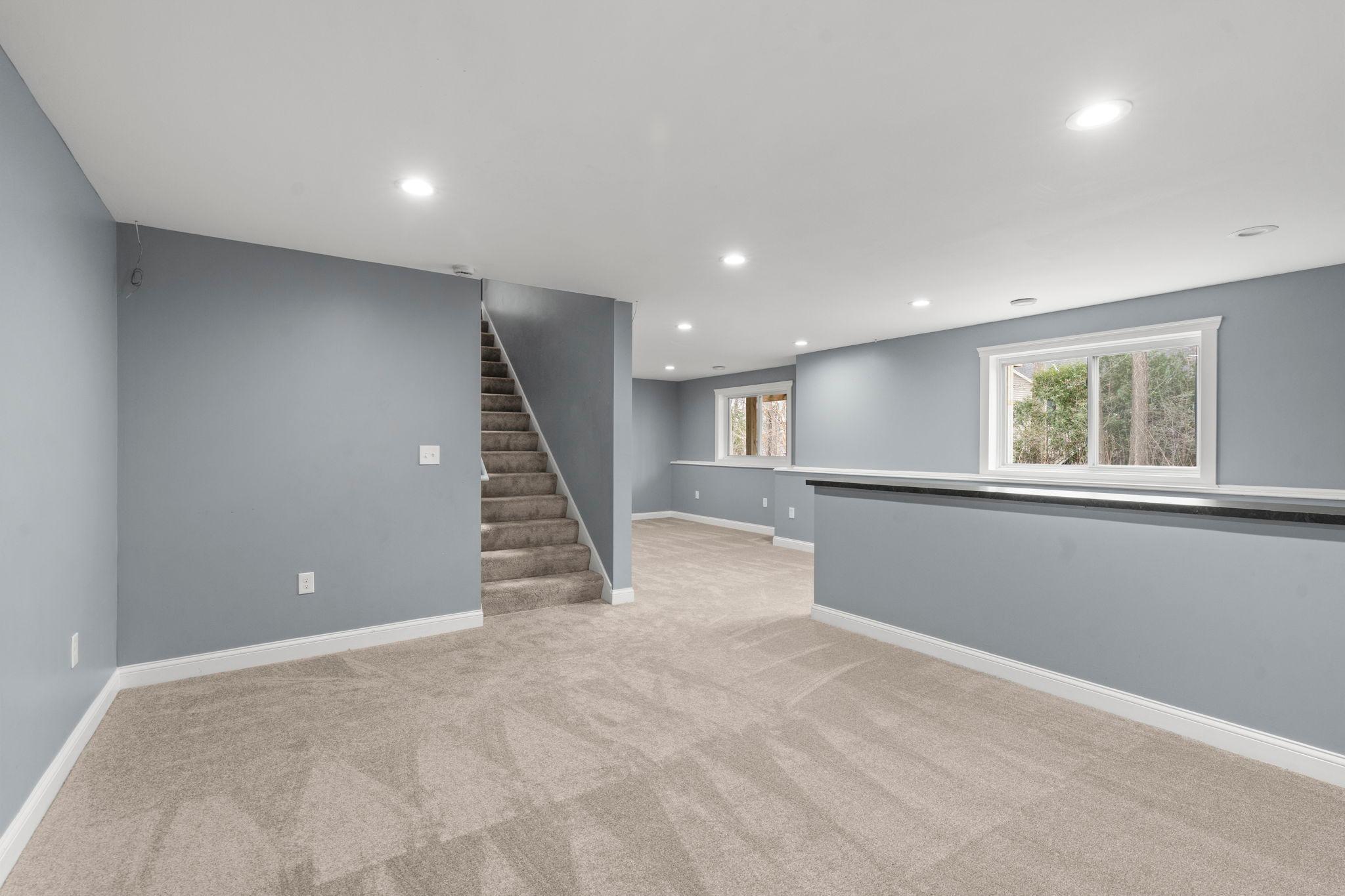 Lookout windows on the lower level make this basement light and bright.