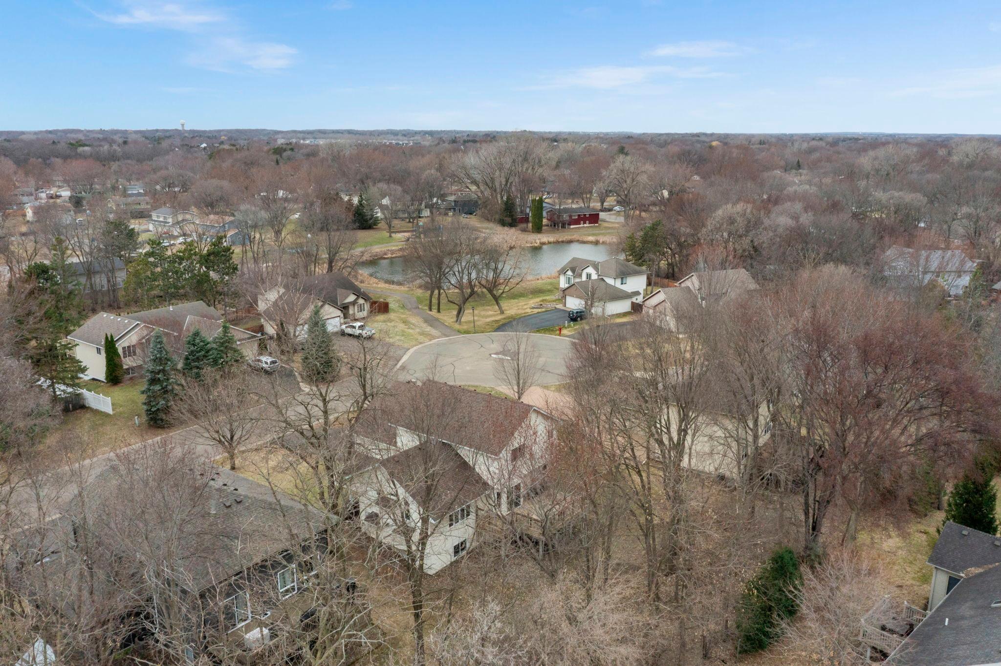 Private cul-de-sac location with access to walking trails around pond.