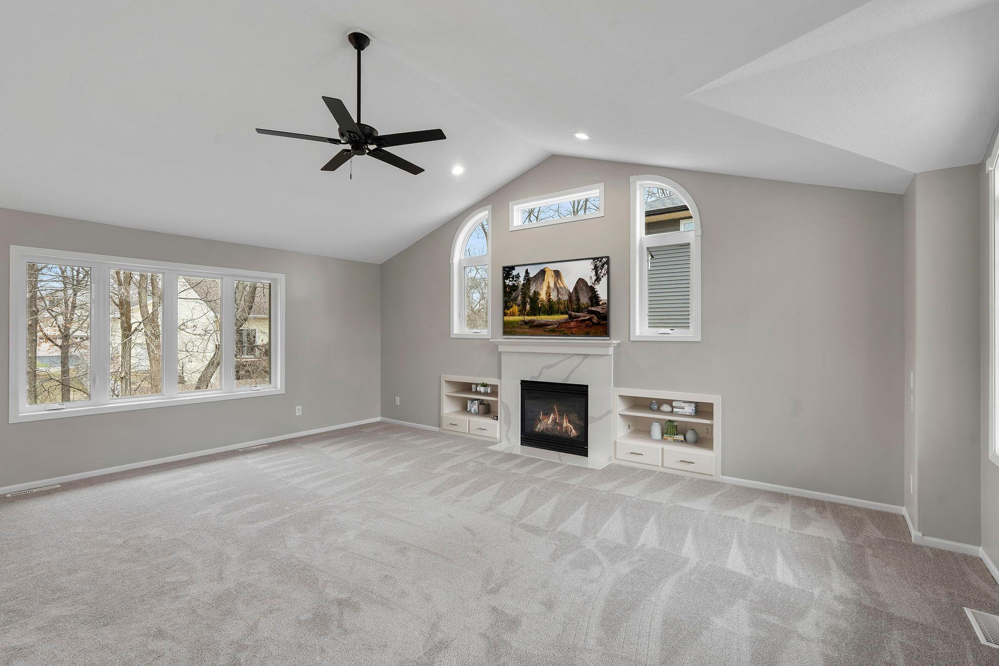 Incredible living room space! Large windows, gas fireplace, built-ins! Fresh paint, new carpeting! Move in ready! TV / shelves virtually staged to envision the possibility.