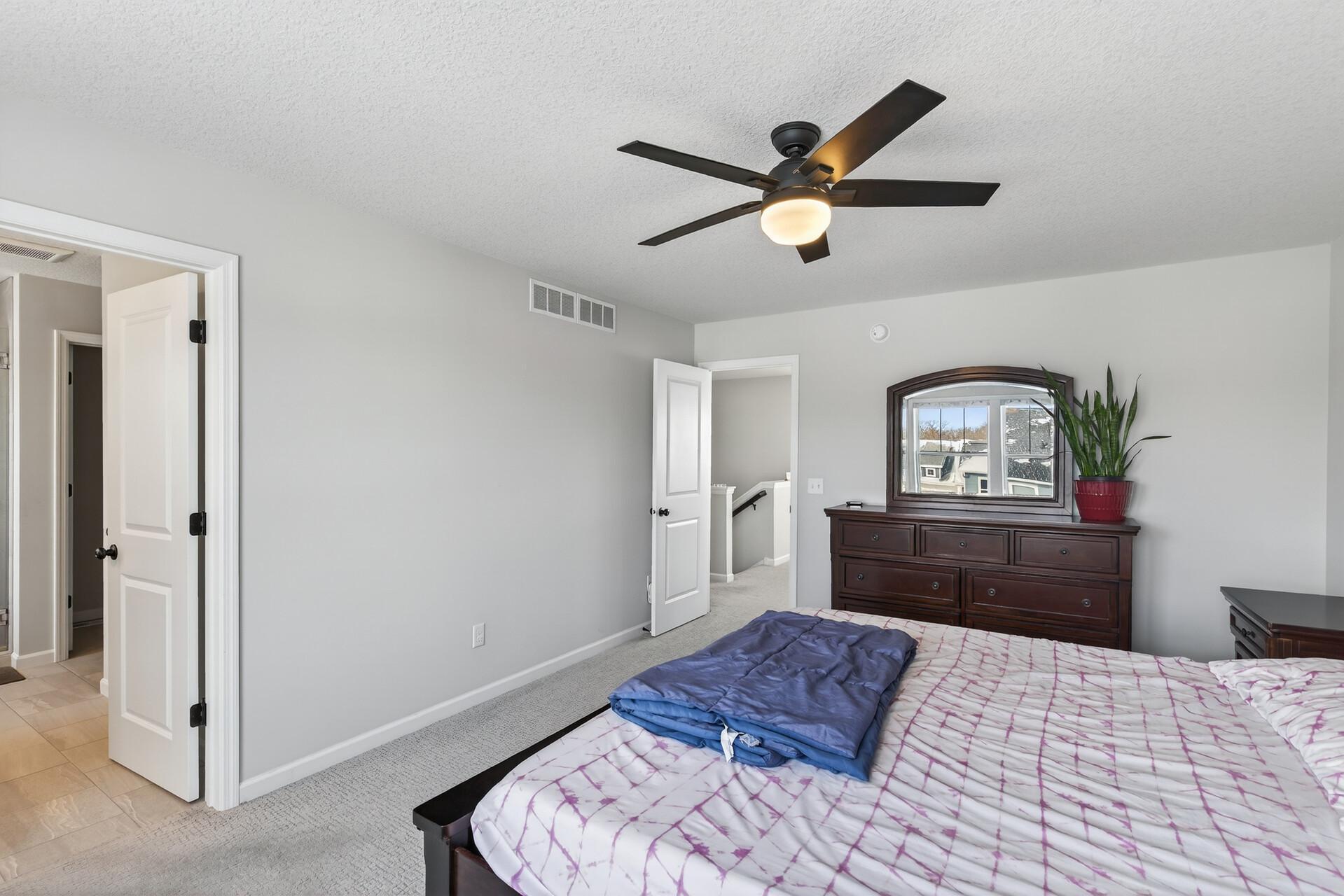 Primary bedroom with ensuite bathroom and walk-in closet