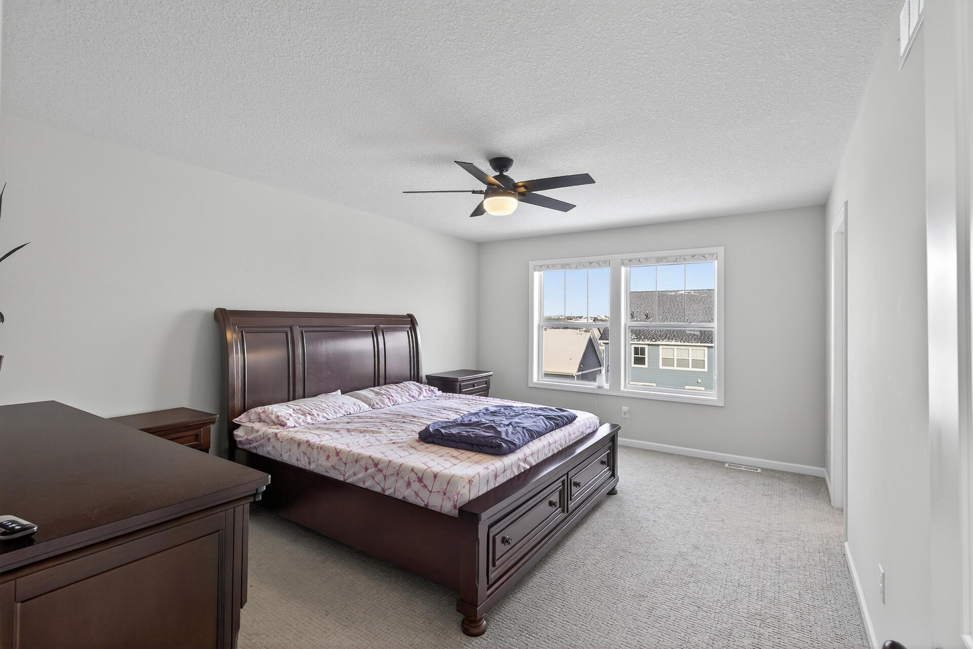 Primary bedroom with ensuite bathroom and walk-in closet