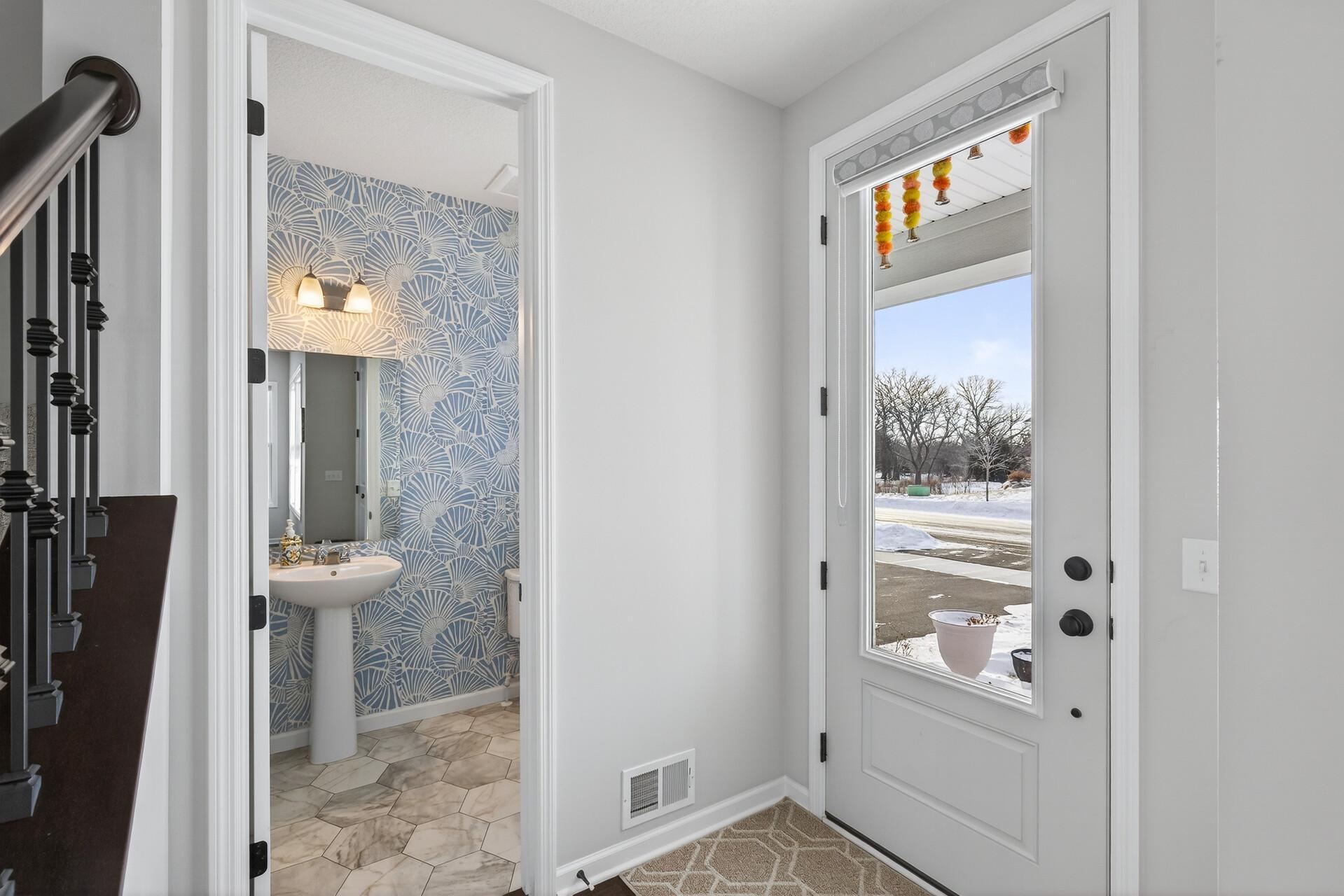 Front door and Half bath on main level near he front door