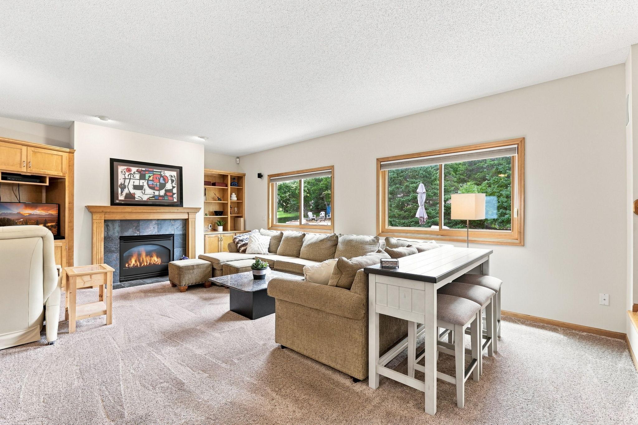 The gas fireplace highlights this room along with the high ceilings