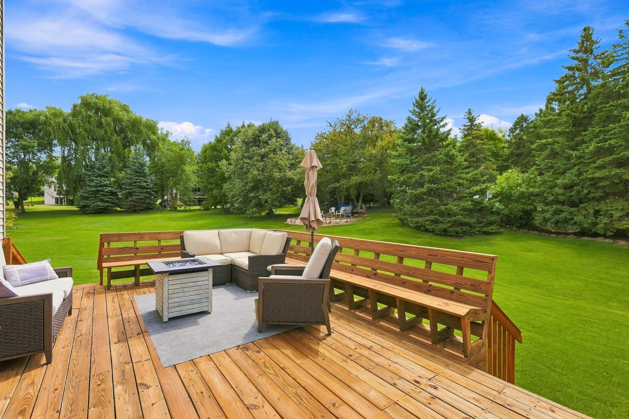 Enjoy your large backyard with the privacy created by majestic pines