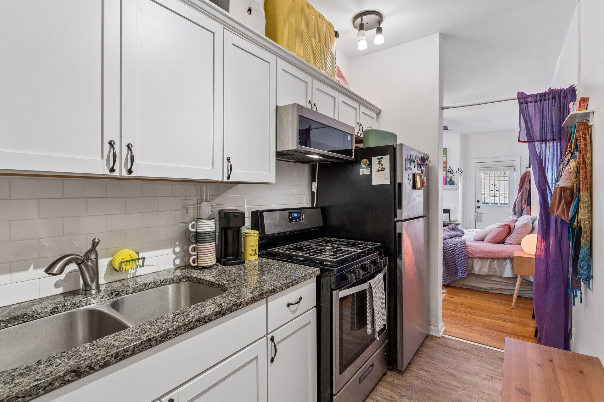Kitchen with stainless appliances & disposal