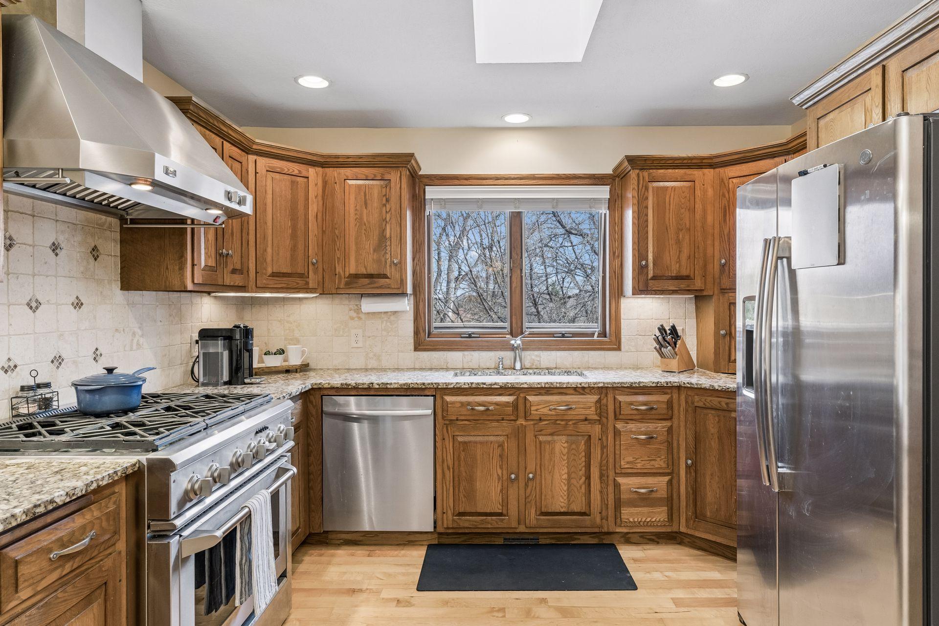 Updated Kitchen with granite countertops and tile backsplash.