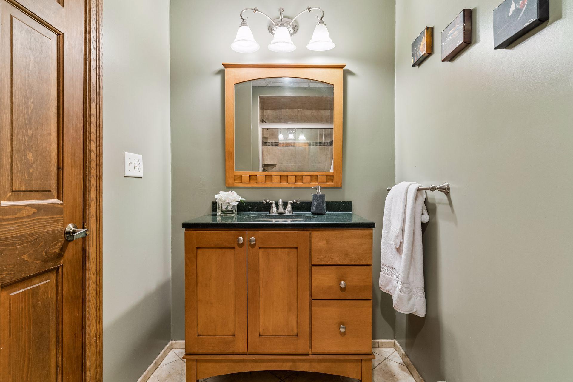 Updated 3/4 bath in the lower level - has tile floors and shower.