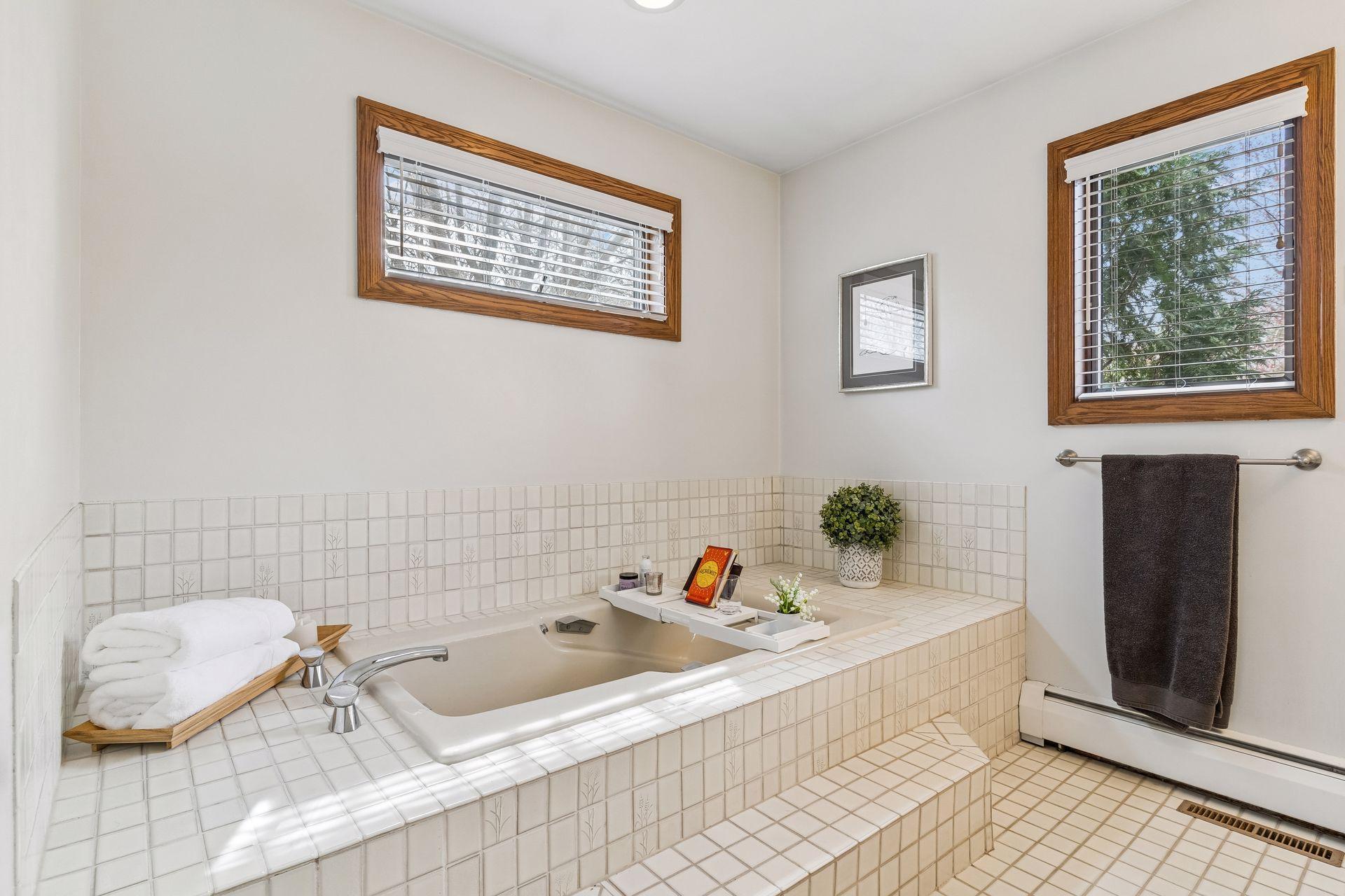 One side of the Primary Bath features a relaxing soaking tub and a sink area. The 2 sided layout is great for everyday convenience.