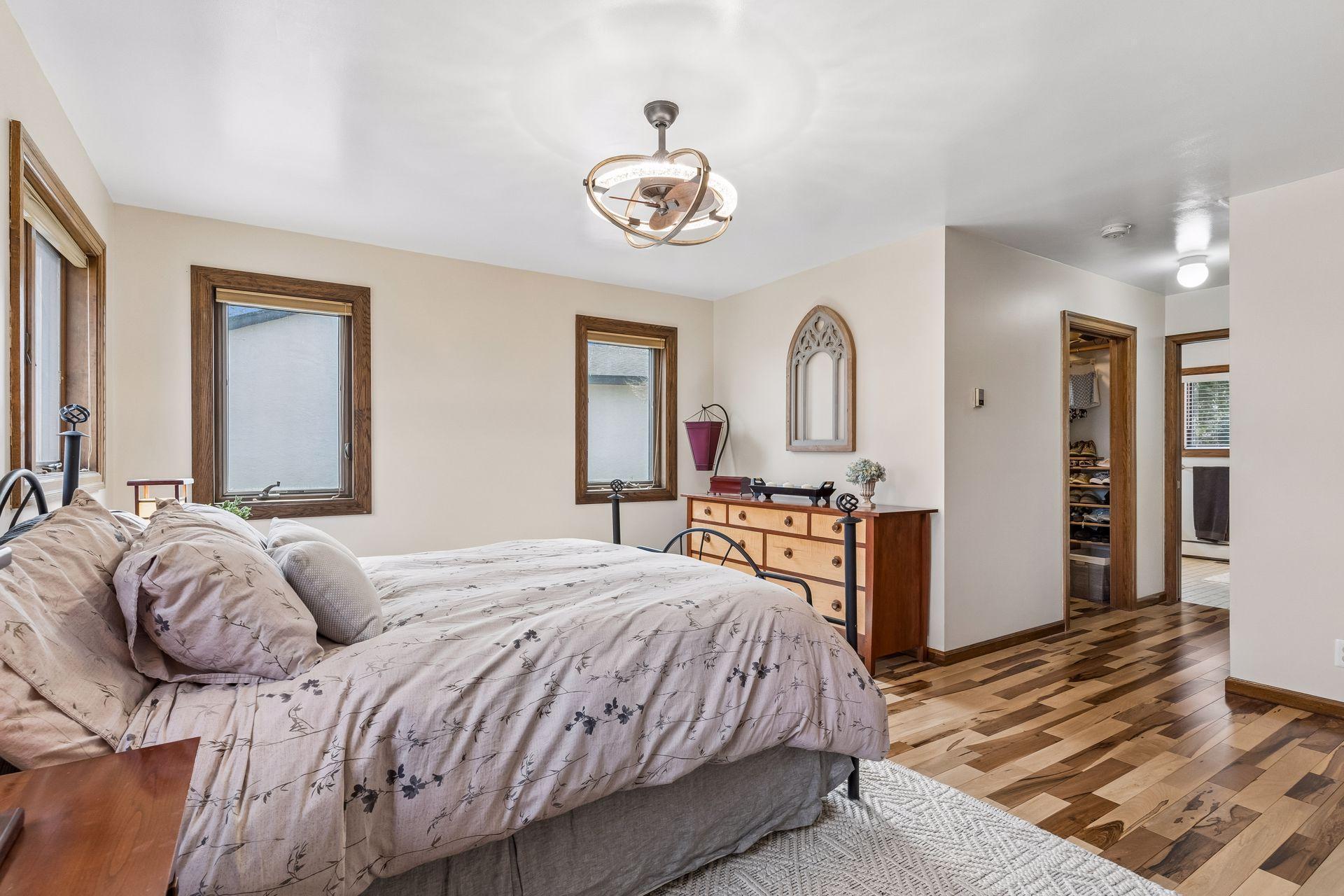 Primary Bedroom has large windows, and double closets (walk-in plus additional closet).