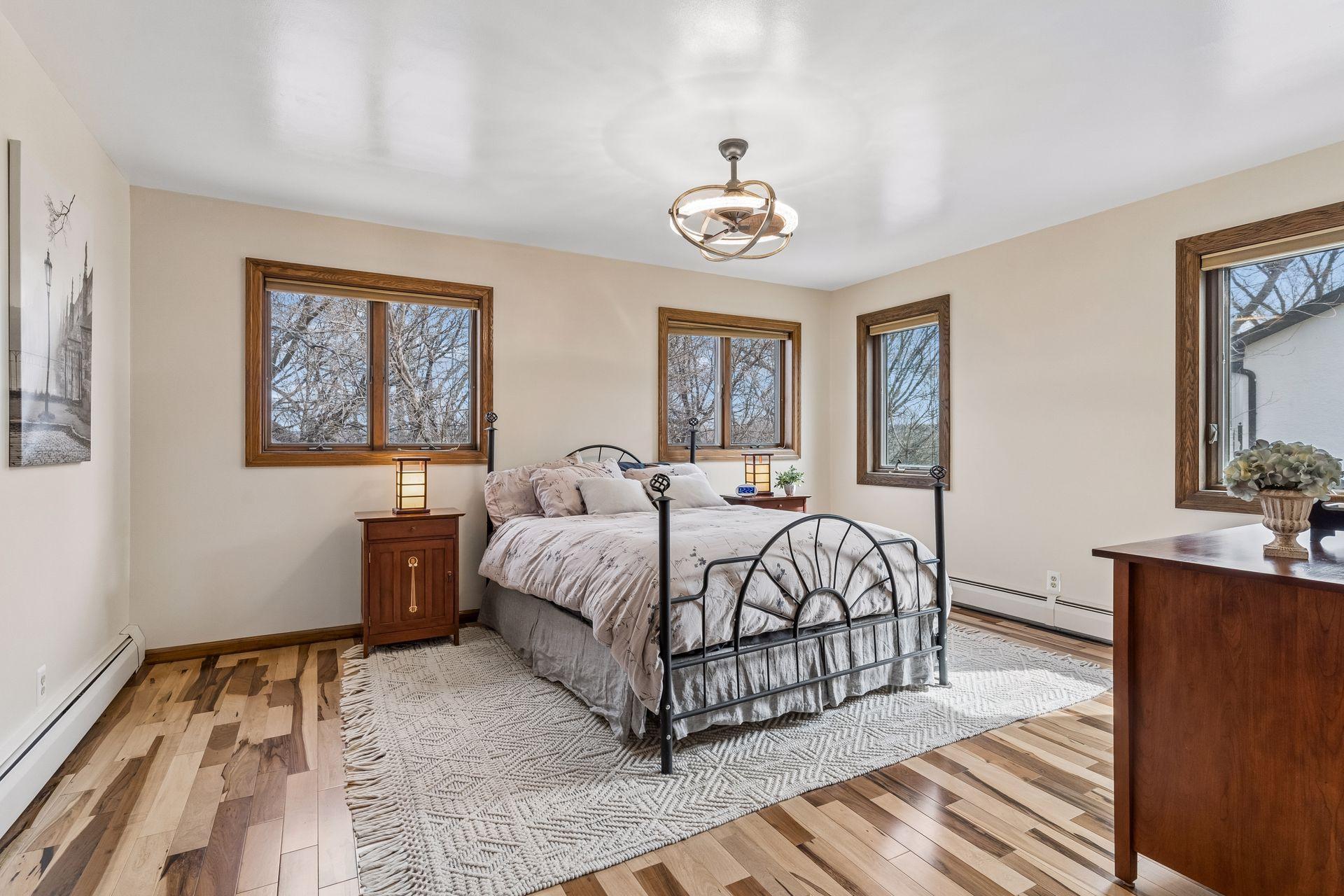 Spacious Main Floor Owner's Suite featuring Brazilian pecan wood floors.