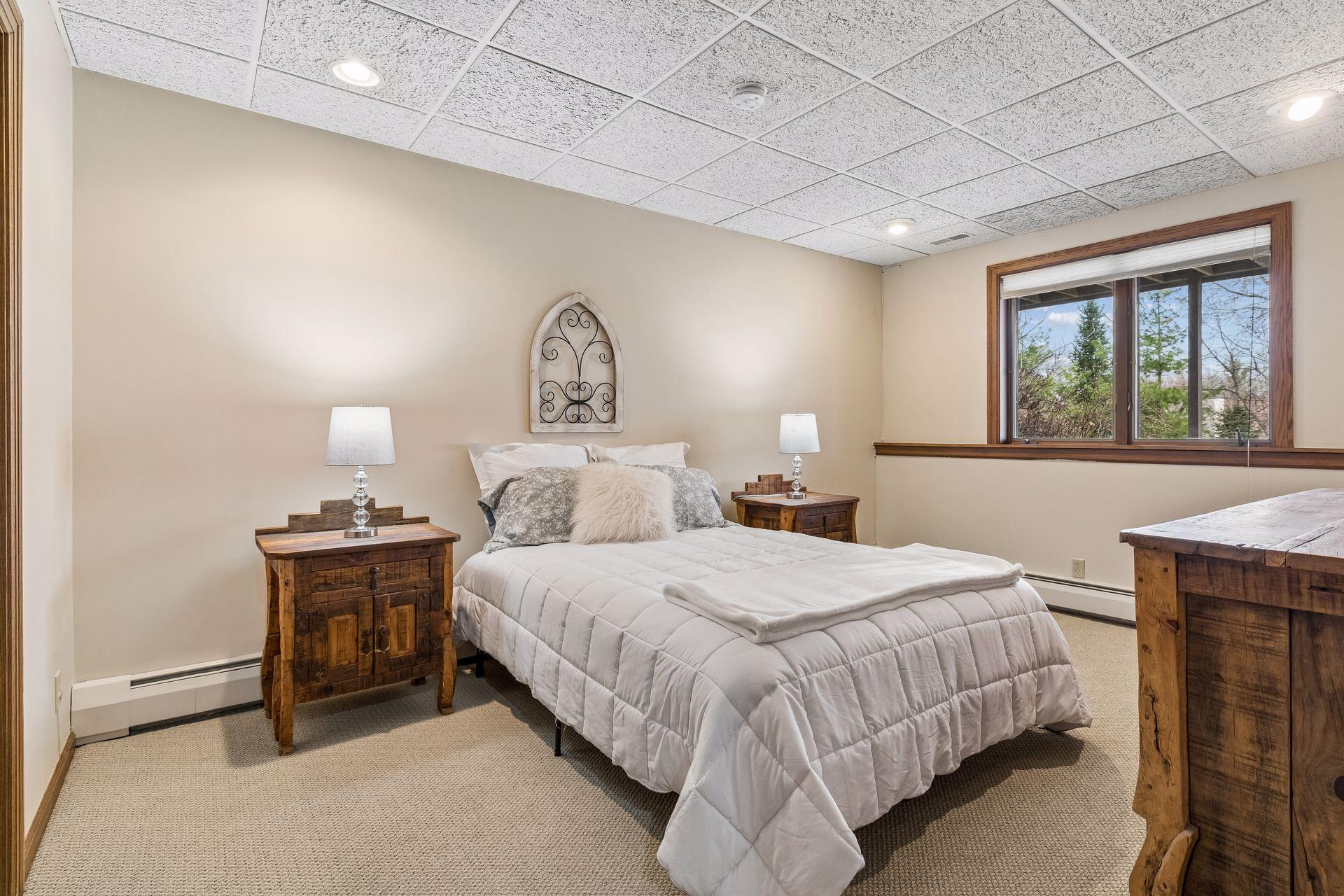 Large Bedroom in the lower level has updated carpet.