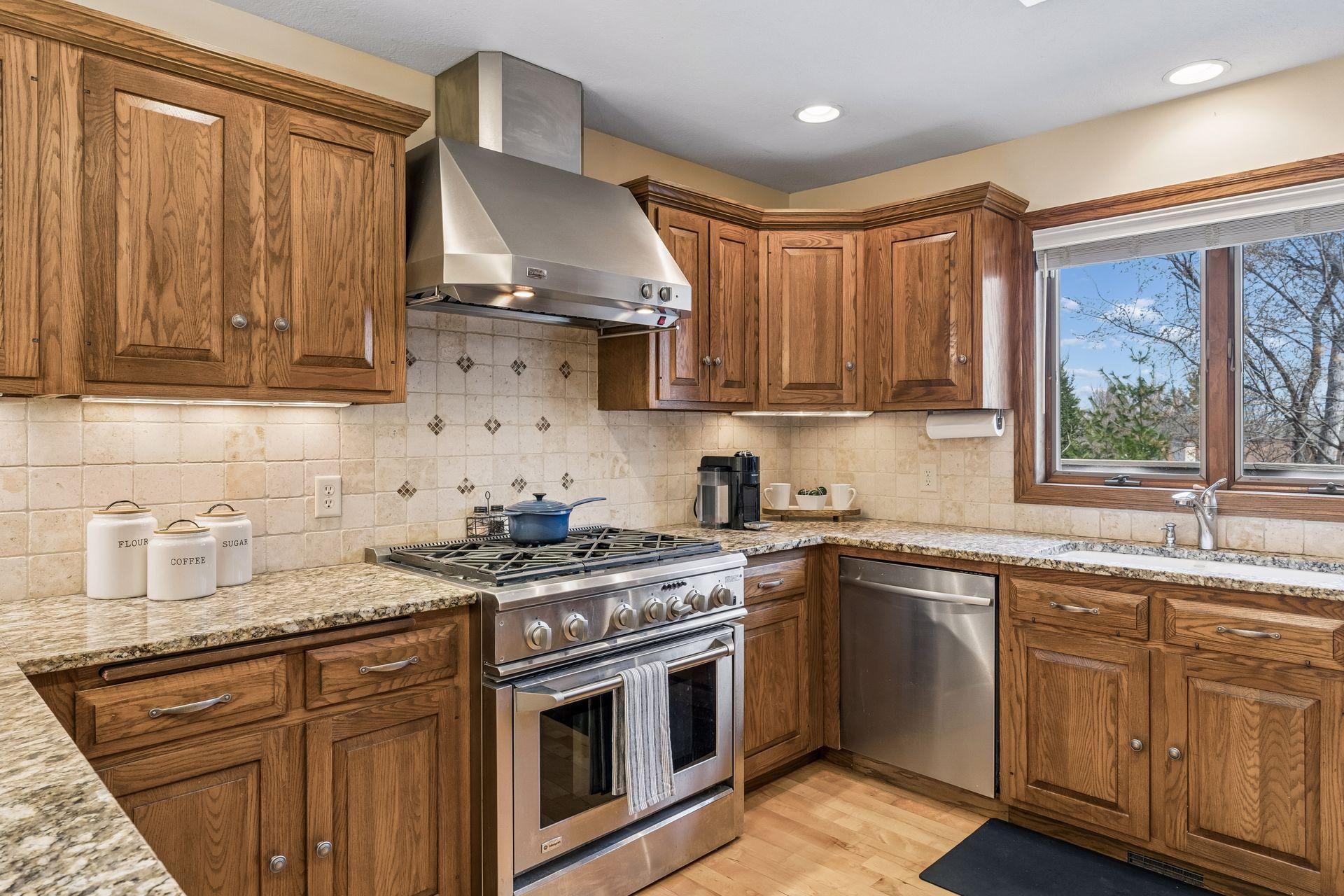 Stainless steel appliances including a 6 burner gas range.