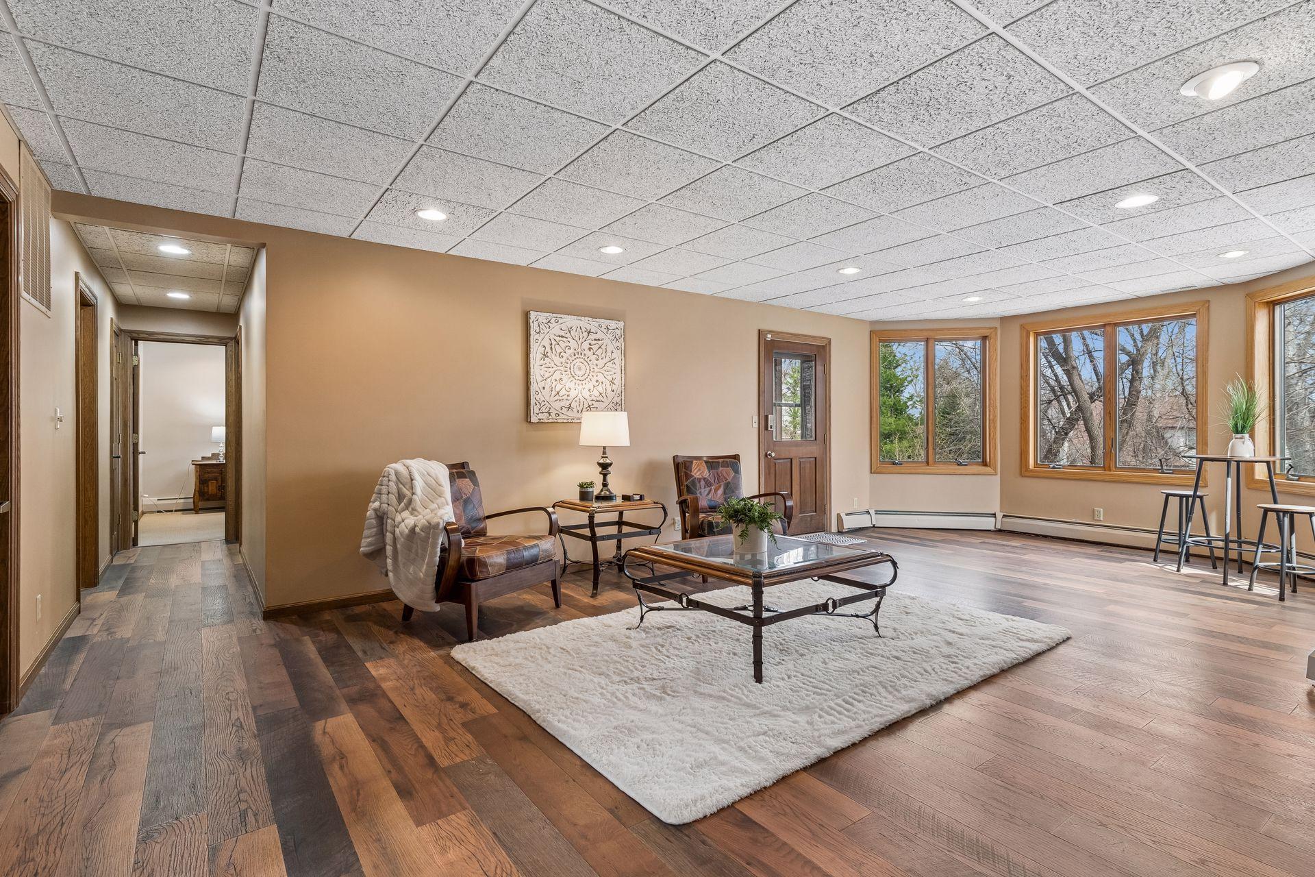 Spacious Family Room with large lookout windows and leads to a huge patio under the deck.