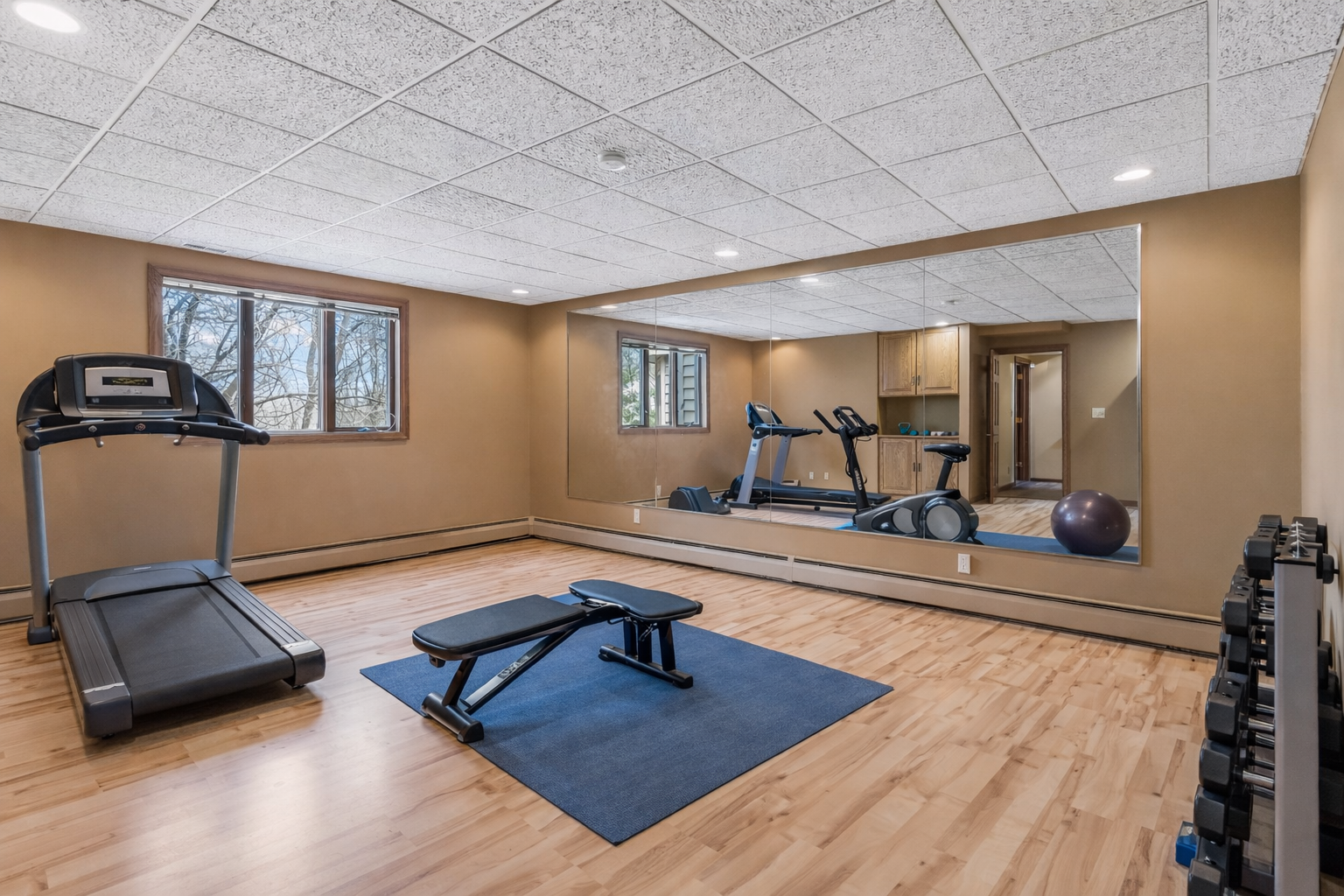 Spacious room with multiple layout options - bedroom, workout room or office. Simply remove the mirror to it to function as a bedroom.