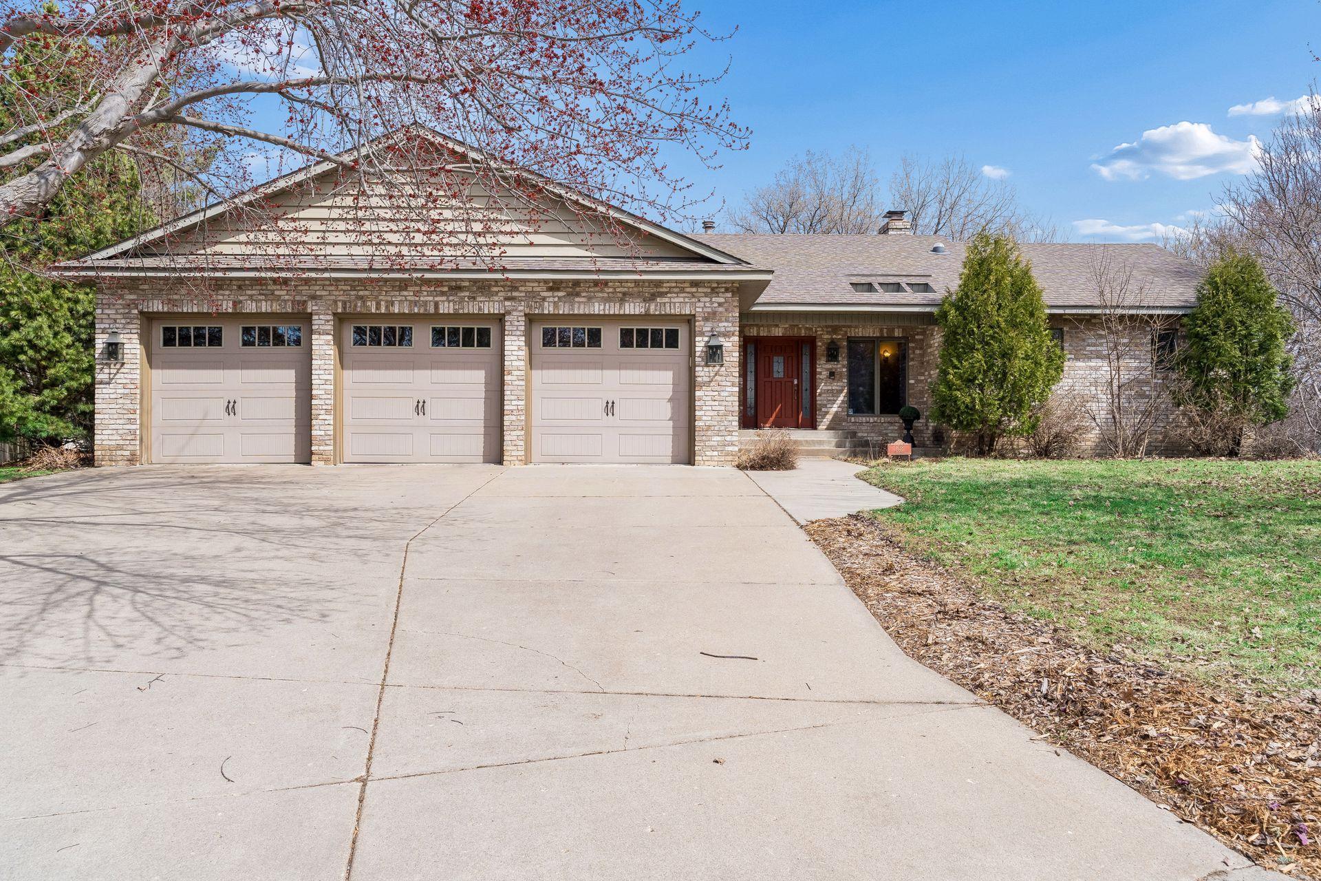 3 car garage and huge concrete driveway.