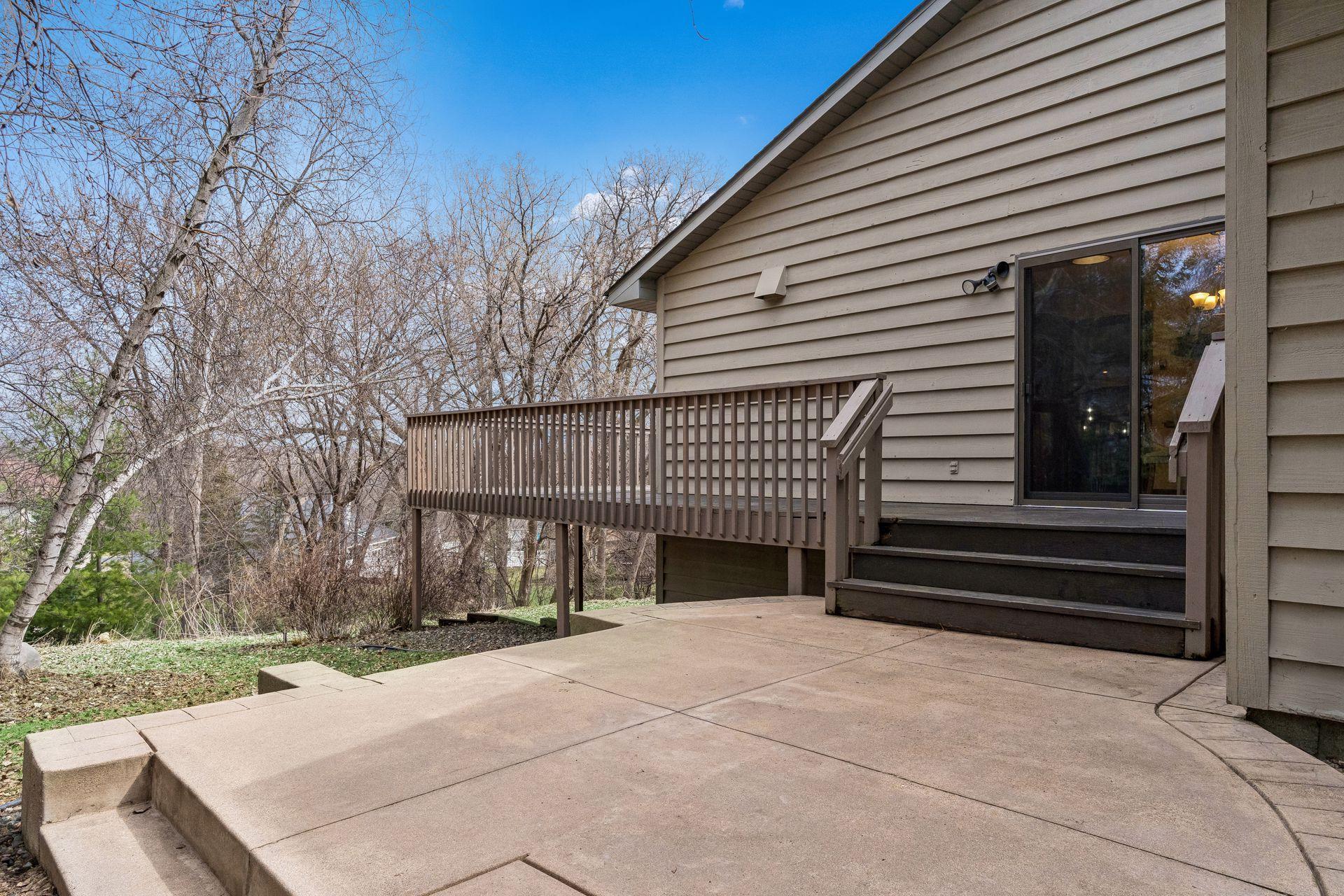 Kitchen and informal dining lead to the deck and patio area off the side of the home.
