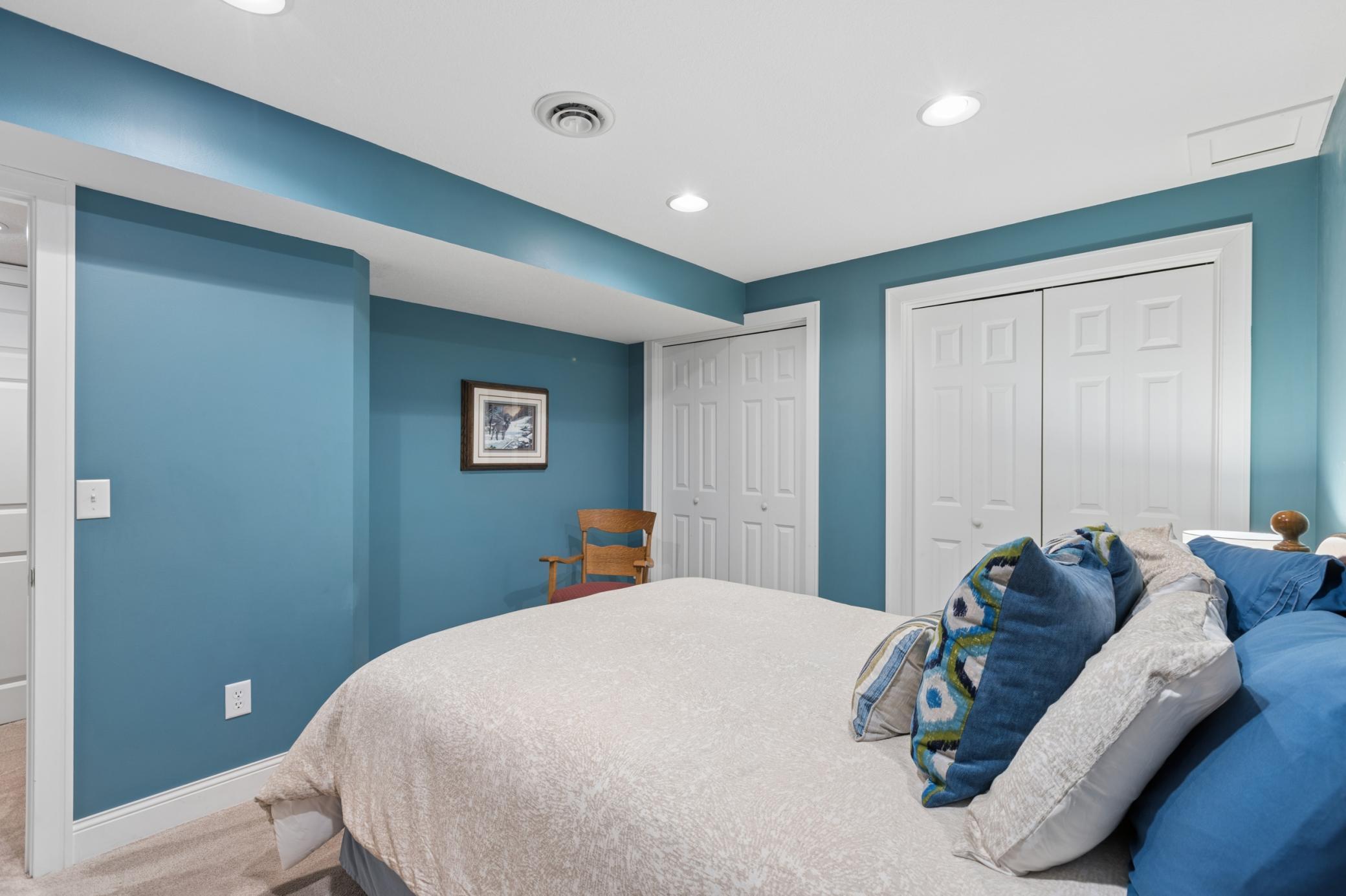 View of the lower level bedroom with two nice size closets. Ideal for off season storage for all four seasons that Minnesota has to offer.