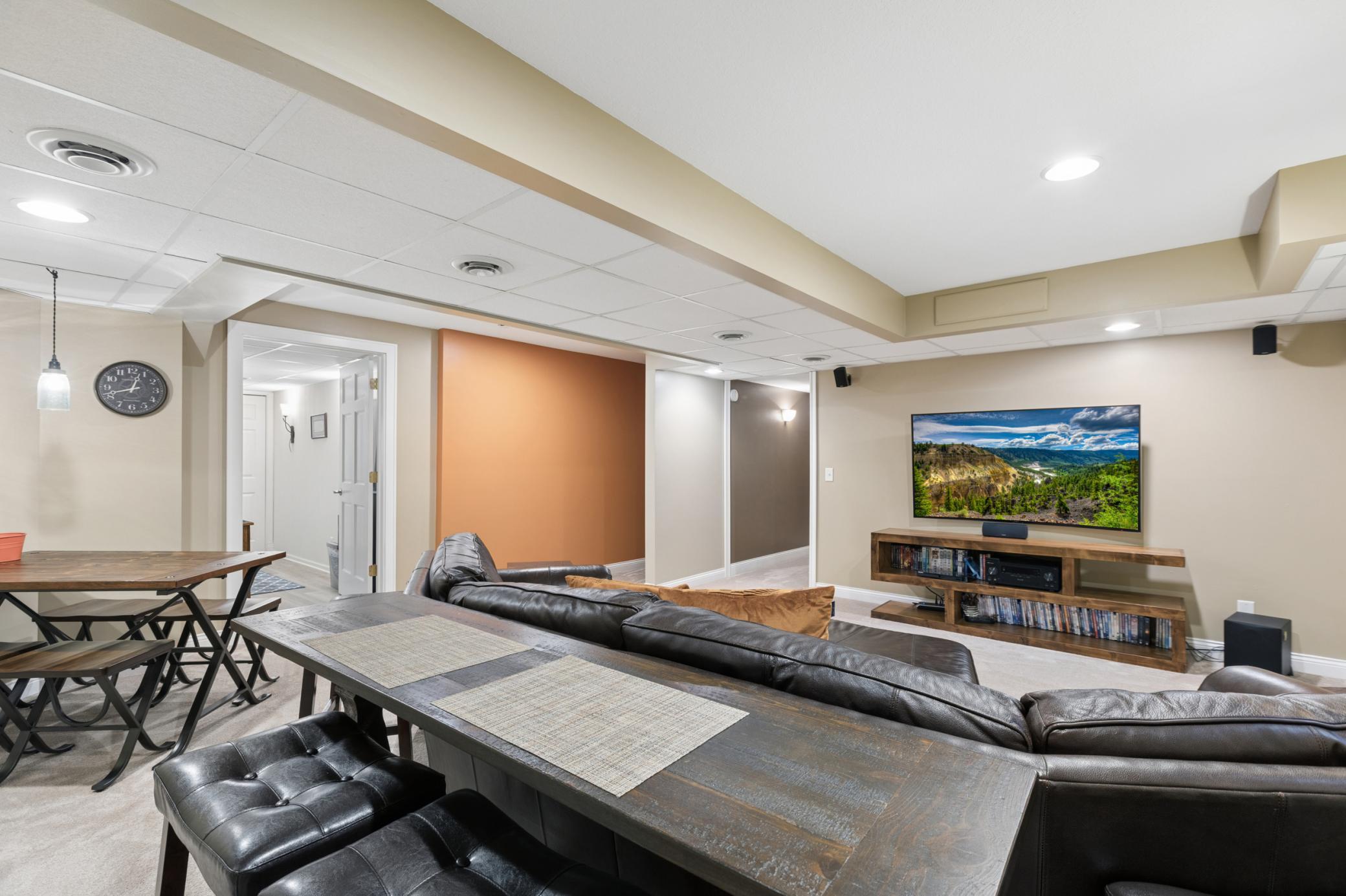 Perfect for entertaining or just relaxing. Off to the side of the family room is a nice workspace or storage room that is finished off with cabinets with a countertop.