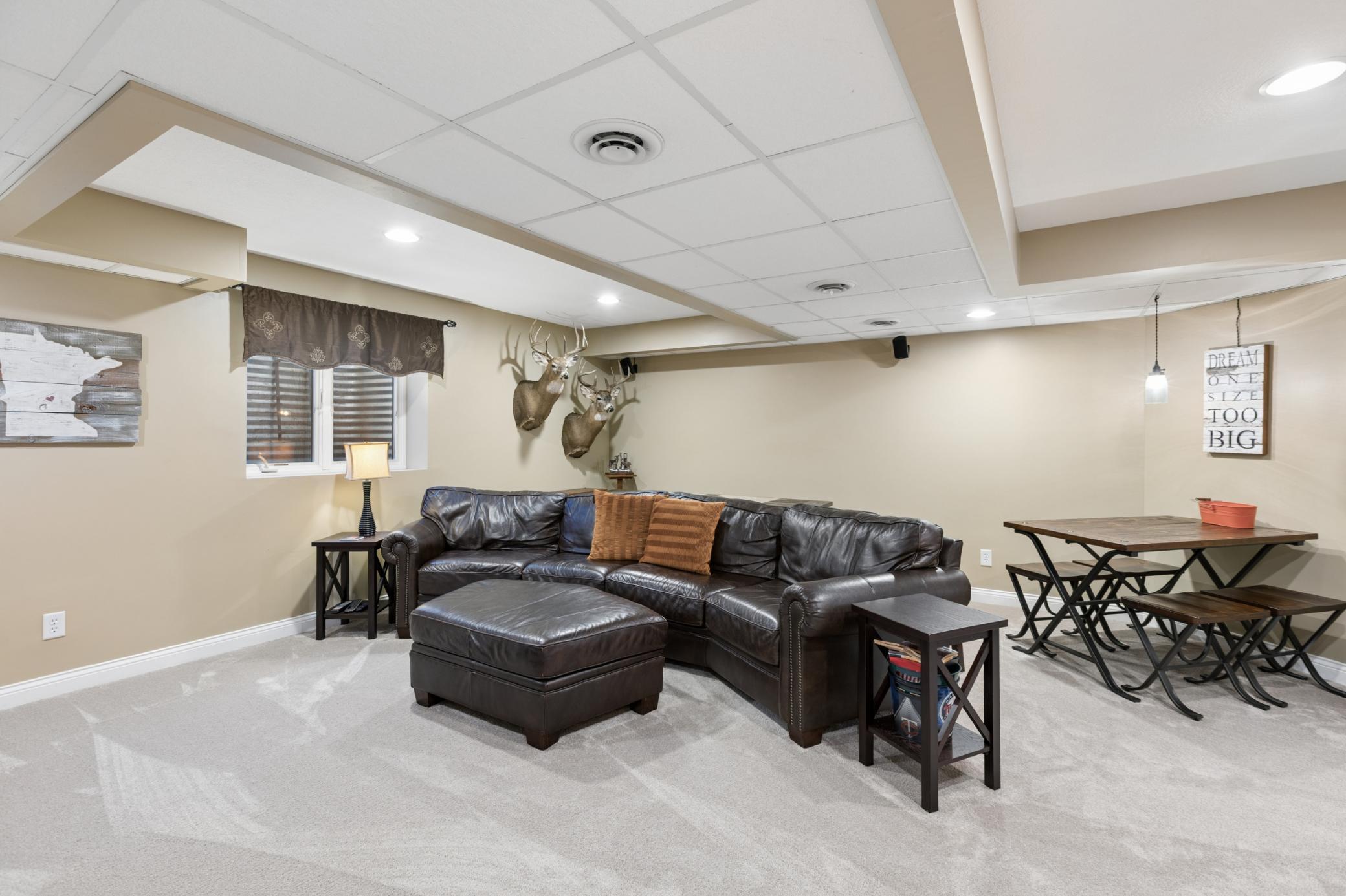 View of the lower level family room. This spacious room measures 18x18 and is great space to enjoy a movie or to play games with all of the extra space.