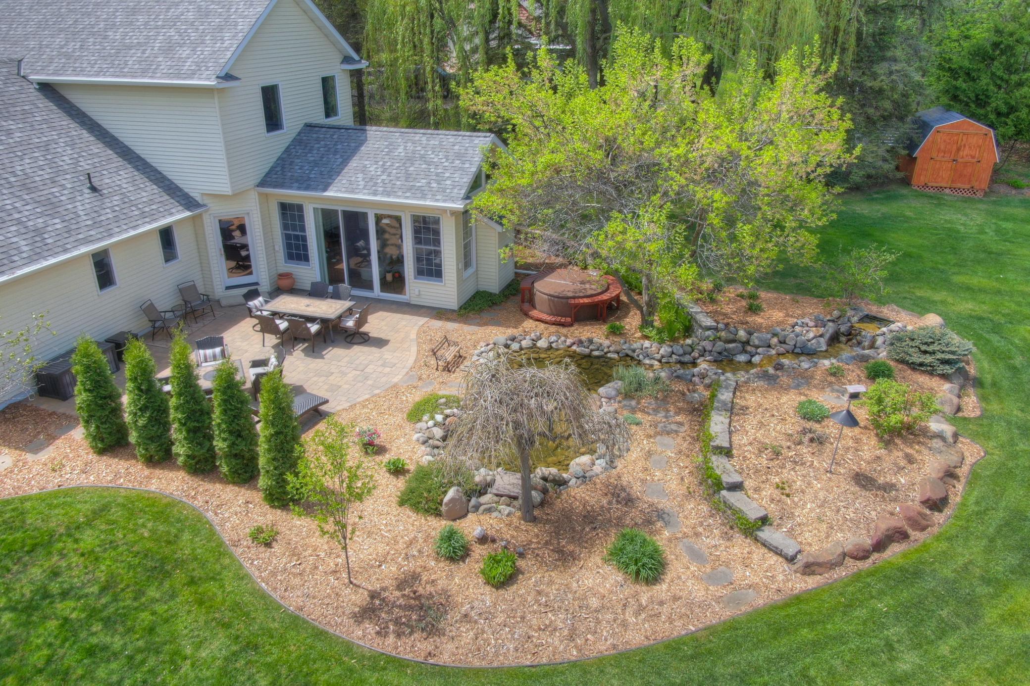 The spacious yard is flat and usable space. Just off the sunroom is a paver patio complete with water feature that is capable of supporting your own koi pond. This is a property you must see in person to appreciate the pride of ownership throughout.
