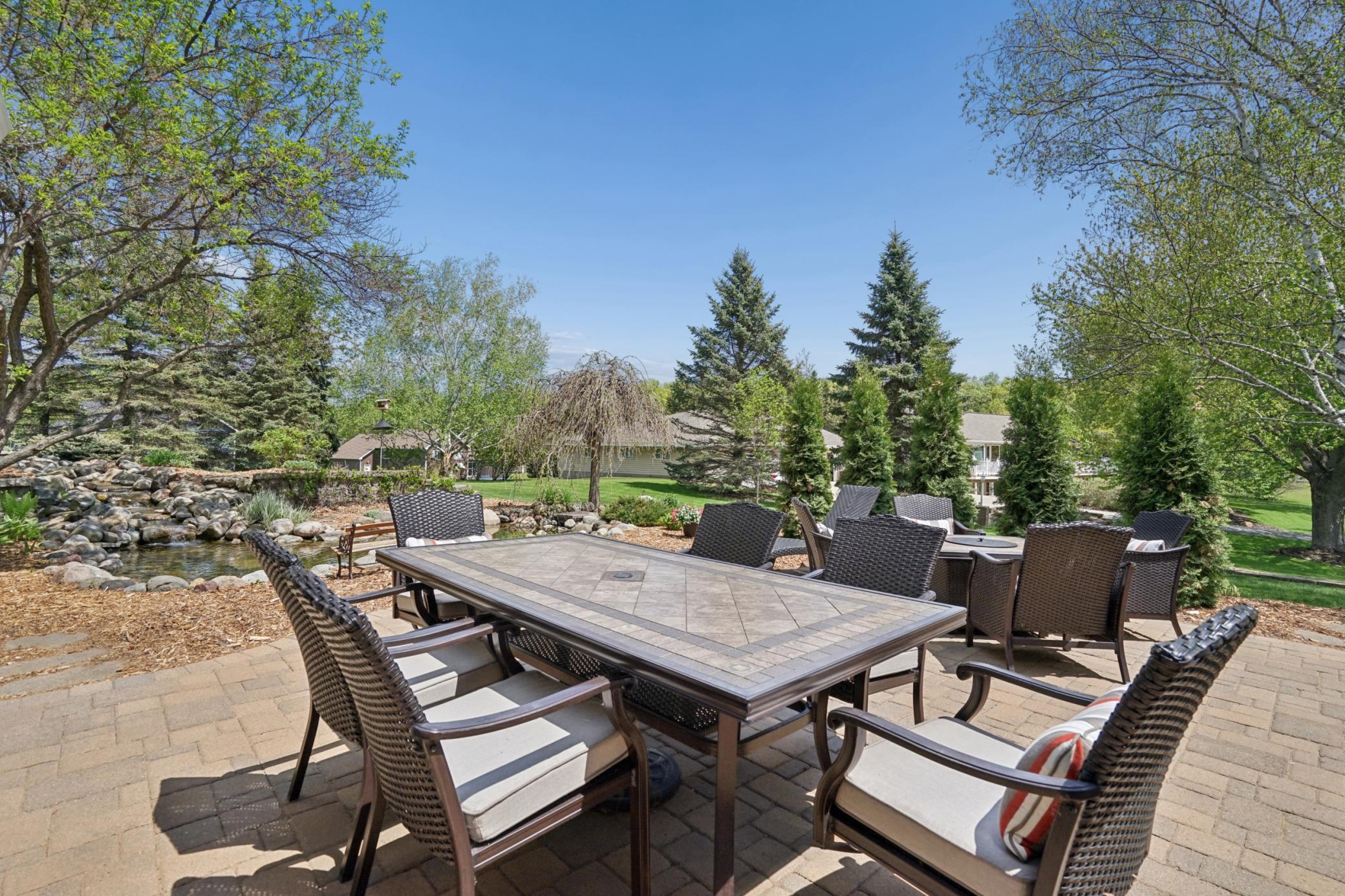 Can you picture yourself enjoying meals with family and friends or relaxing as you listen to the water trickle down the waterfall of the koi pond. This great patio is really an extension of the living space into the outdoors.
