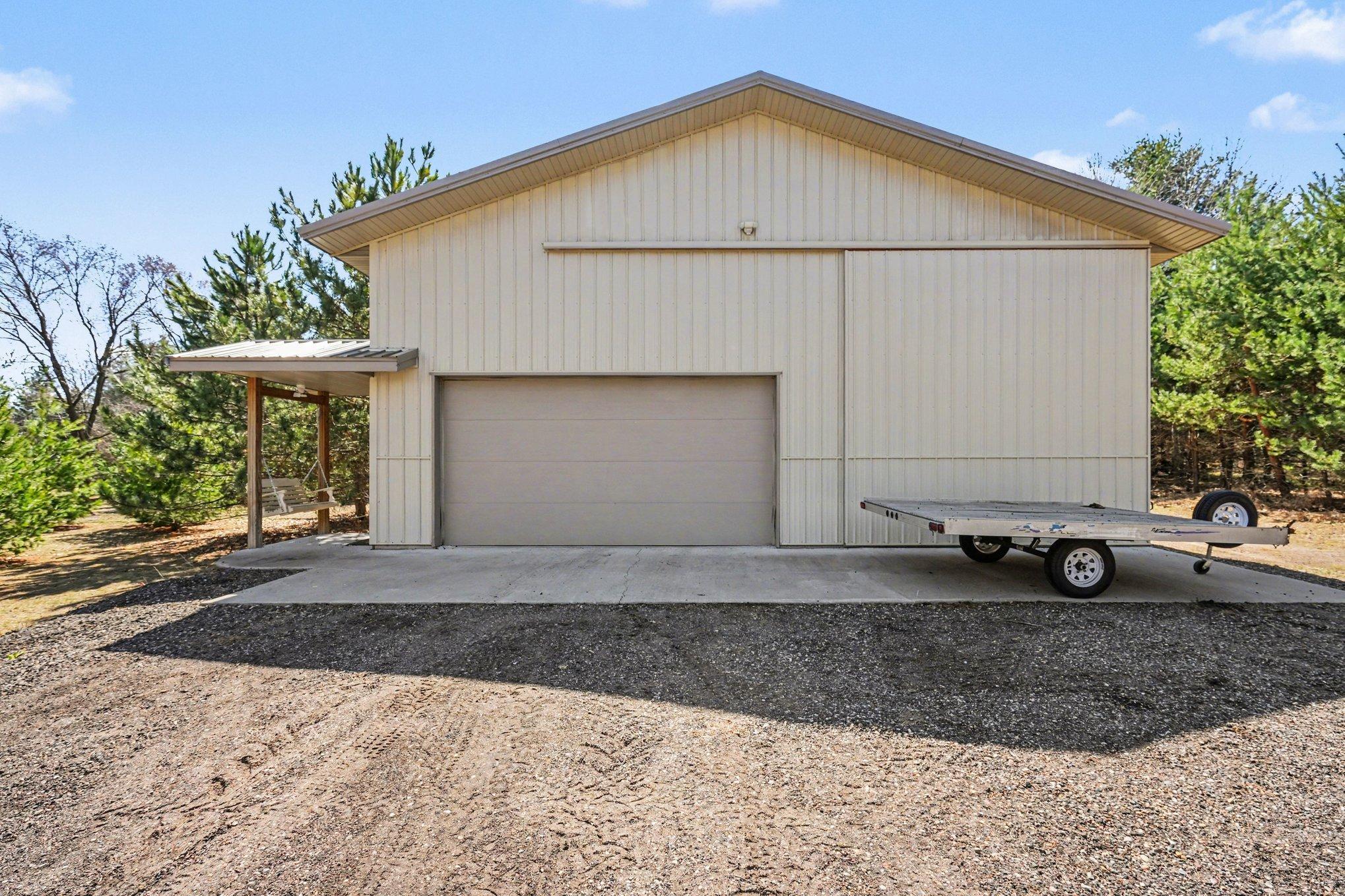 Built in 2019 on a Concrete Floor. This Heated Pole Barn has been a Mechanic's Dream, Stored many Toys/ an RV, as well as Housed Parties! Consider the Possibilities~