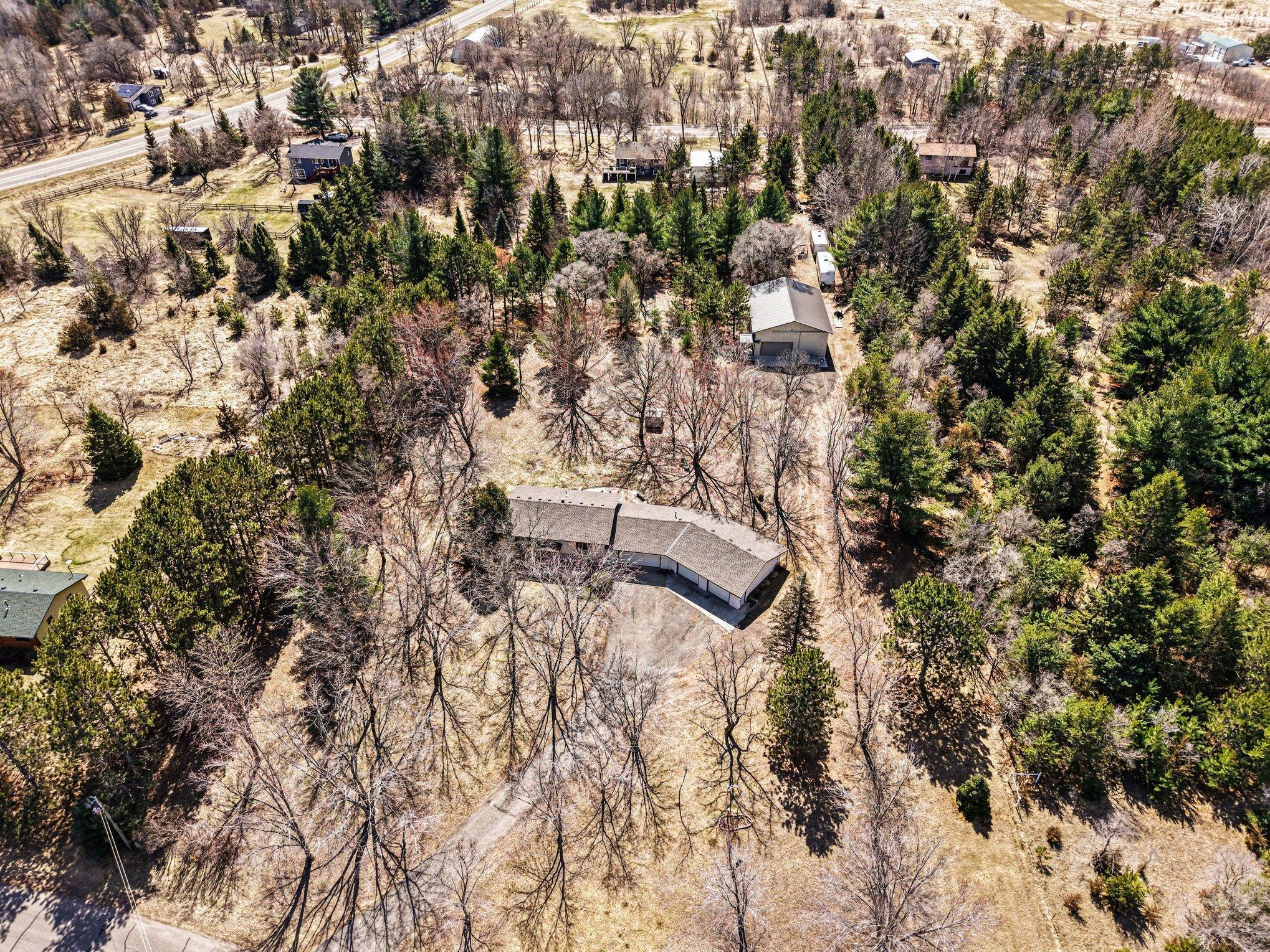 Aerial Showcases a Private Setting and Driveway