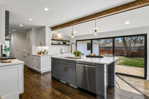 A full wall of windows with slider to the maintenance-free deck allows for ease of connecting the outdoor spaces.