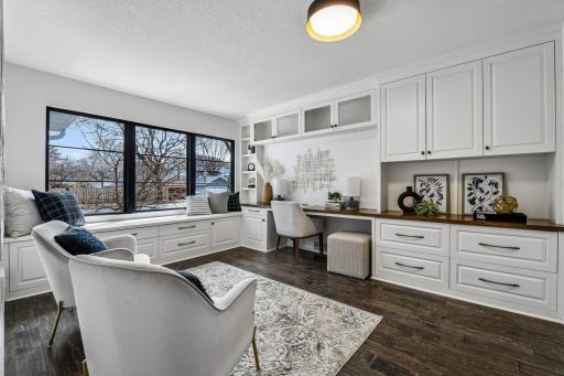 The third main floor bedroom offers flex space with fantastic built-ins/office space and a wall closet with custom organizers.