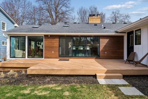 Beautiful perennials surround the large, maintenance-free deck with access to the expansive, level yard.