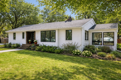 Expansive rambler featuring main level living (Image has been digitally enhanced to approx/possible summer foliage - some plantings may vary)