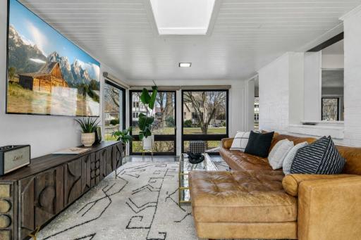 The sun room is sure to be a favorite room in the home - cozy yet connected to the other gathering areas of the home.