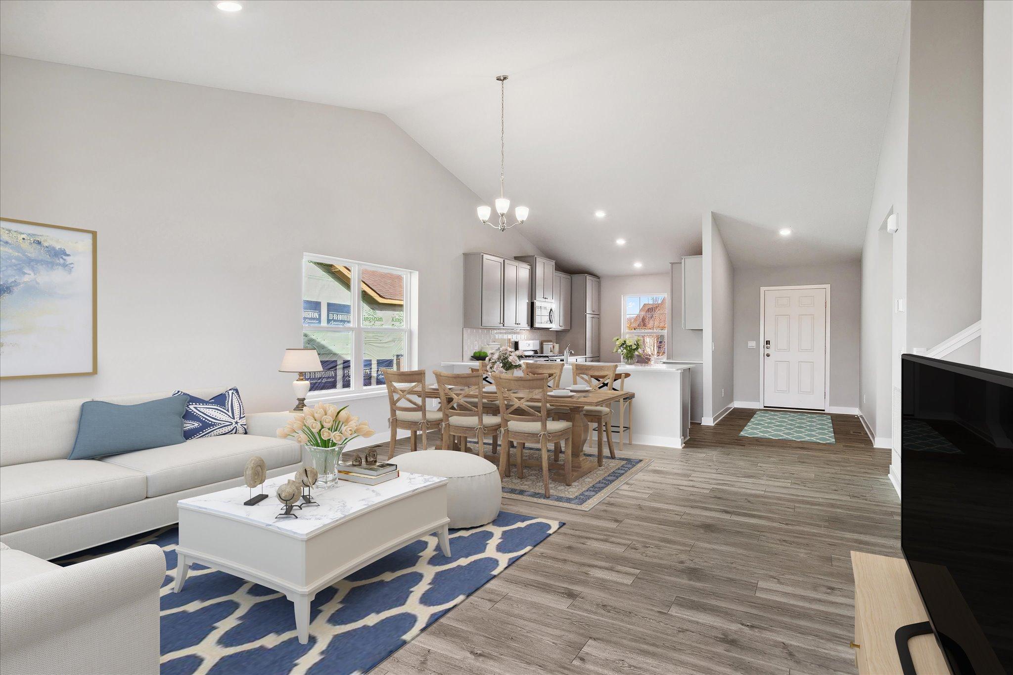 Bright and open with vaulted ceilings, the main level of the Rushmore is a sight to be seen! *Picture is of model home; actual finishes may vary.