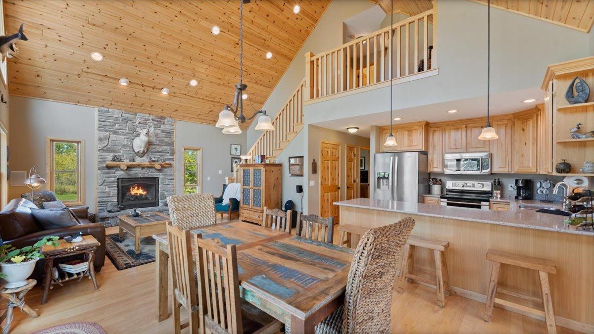 30381 Wildwood Rd, Ashby, MN 56309 Hardwood floors, stone counters, wood vaulted ceilings, stone surround gas fireplace all the comforts of a custom - built home.