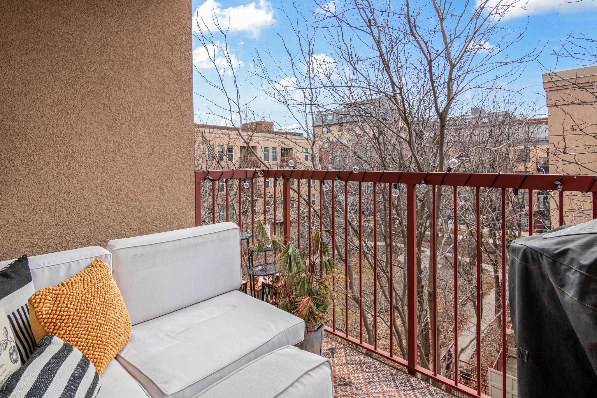 Large Covered Patio with Grill and Lounger overlooking Shared Open Space