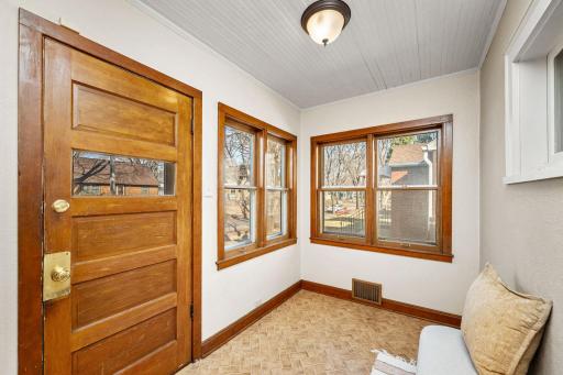 Cozy front entry porch, great for shoes, coats and to break the cold of winter