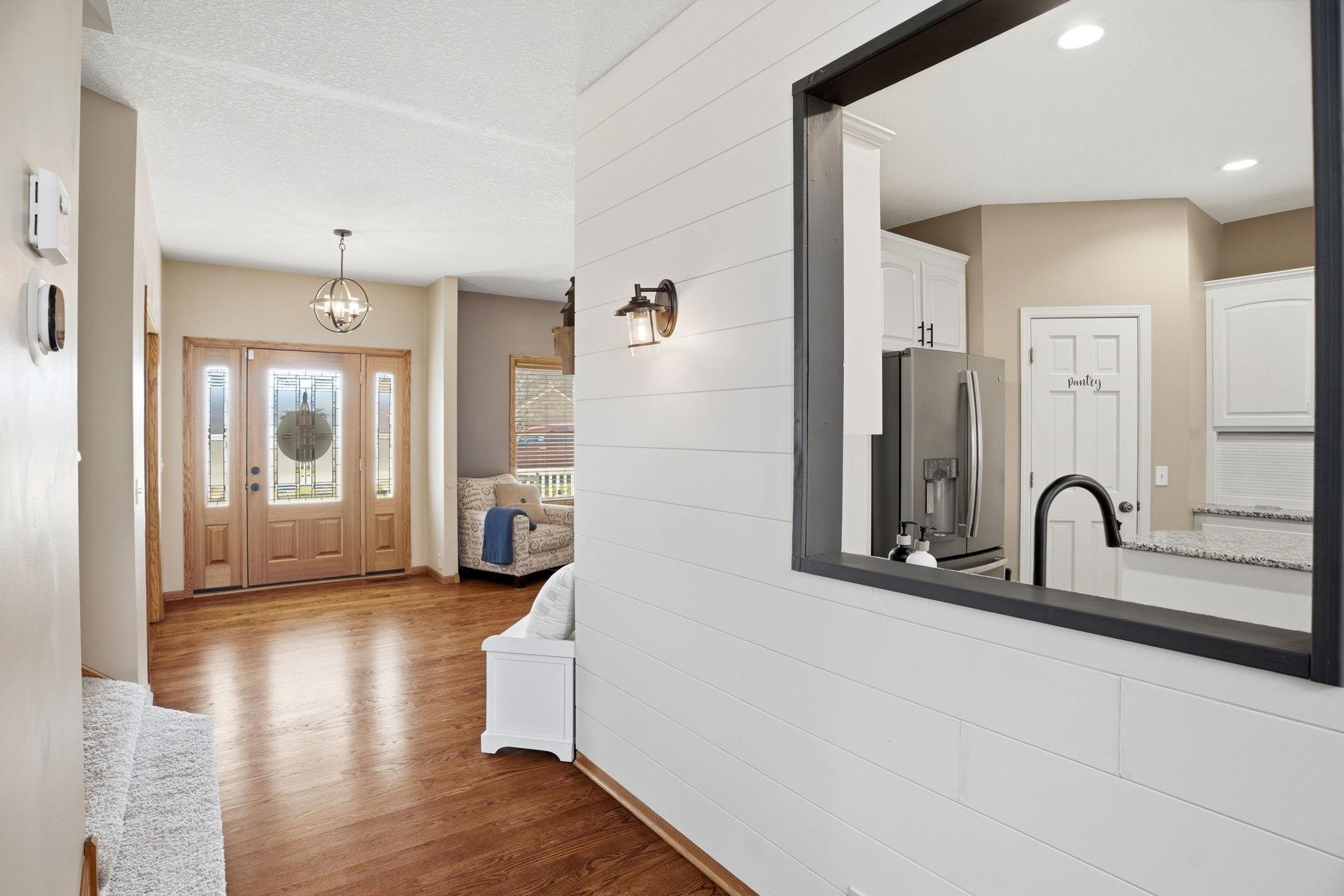 Charming shiplap accent wall, modern light fixtures throughout the home, and many areas freshly painted make the spaces that feel like new.