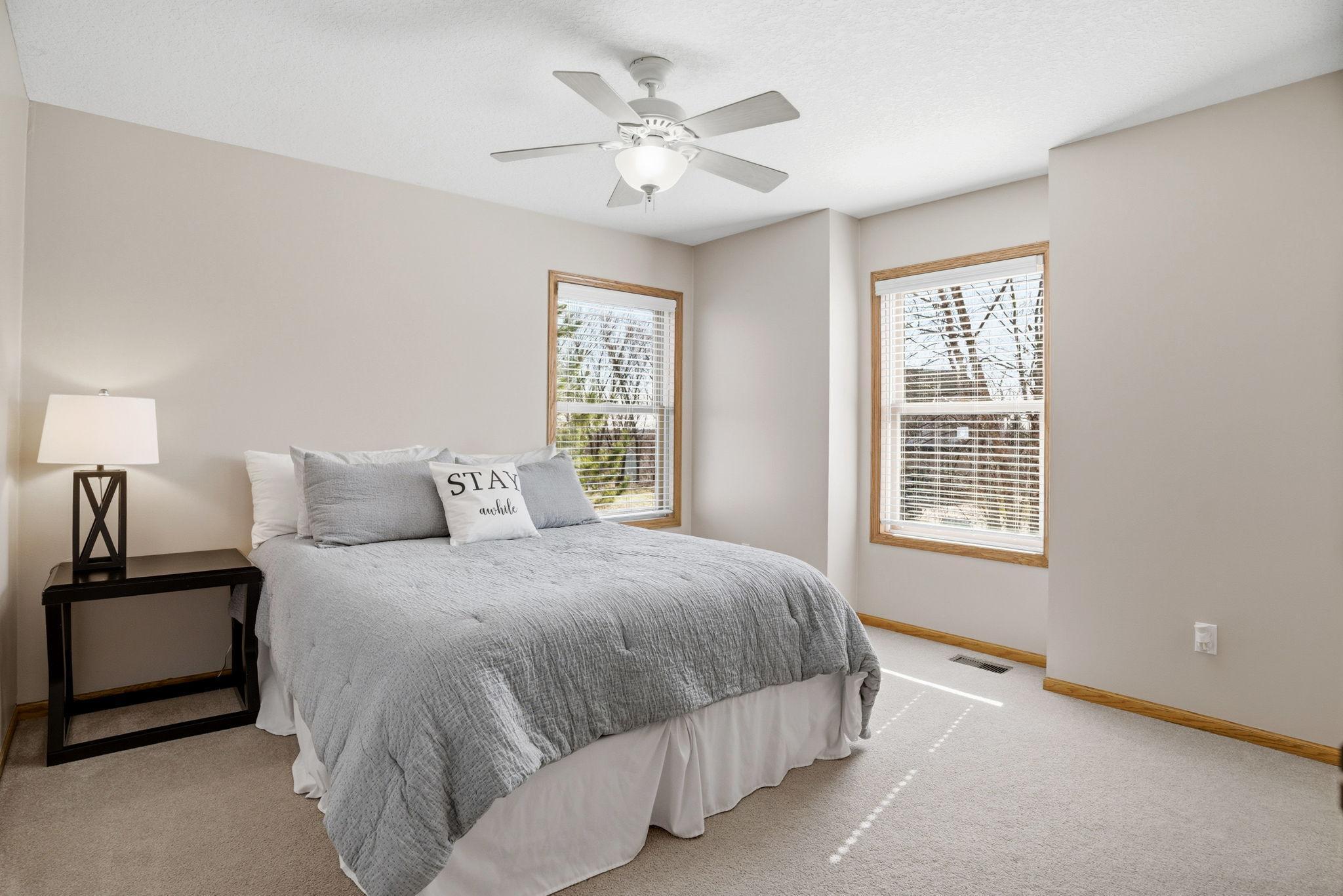 Upper-level third bedroom includes a private 3/4 bathroom, perfect for family or guests.