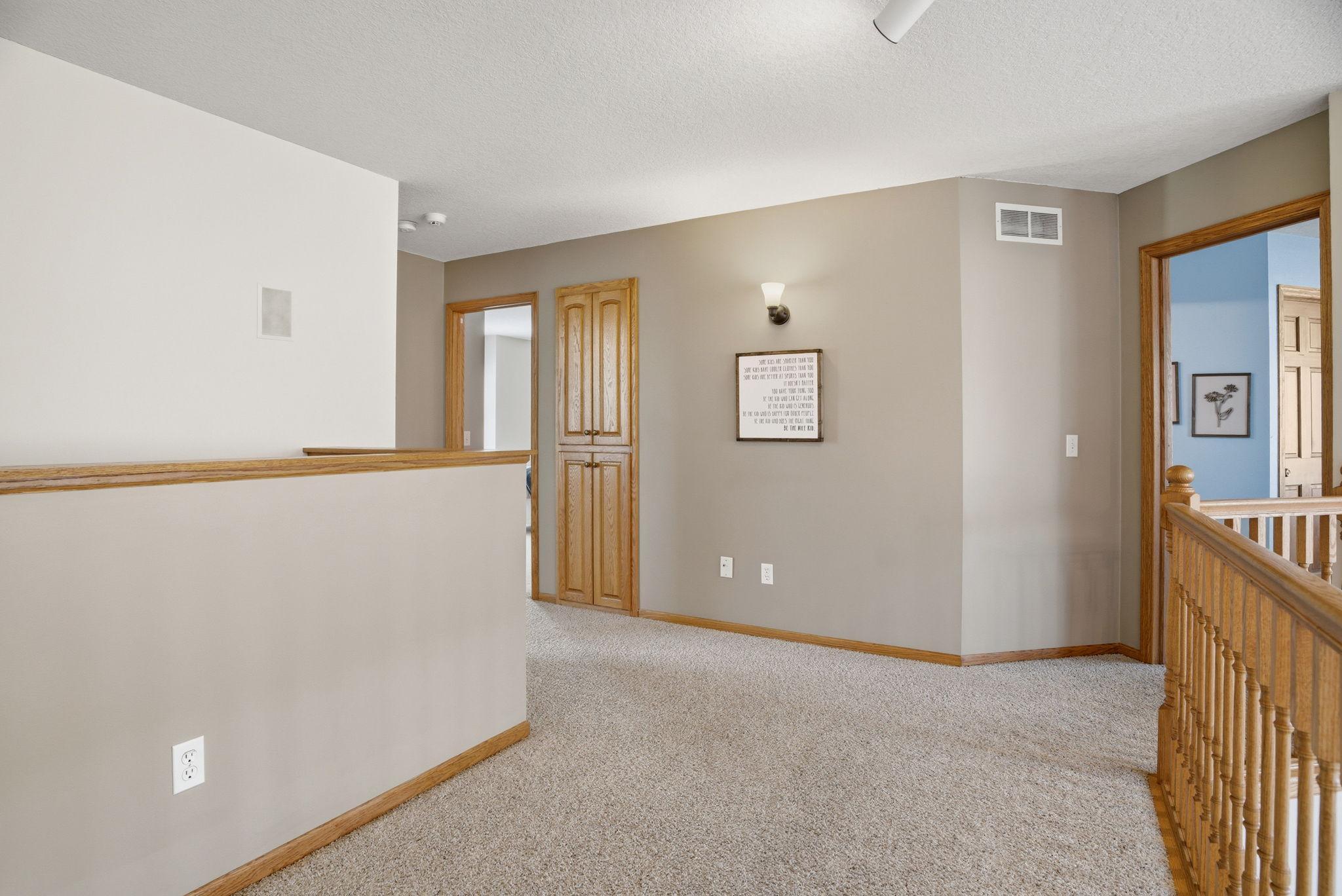 At the top of the stairs, an open landing provides access to three spacious bedrooms and two bathrooms.