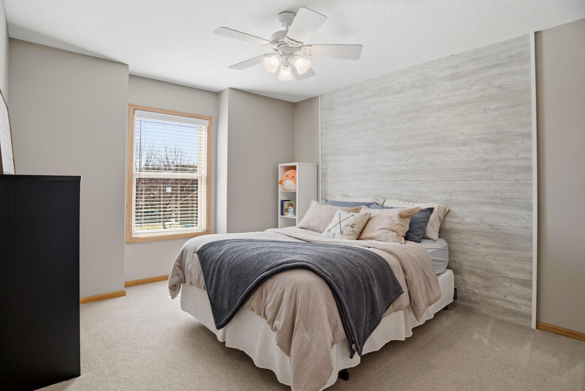 Very large upper-level bedroom featuring a walk-in closet and access to a Jack-and-Jill bathroom—perfect for family or guests.