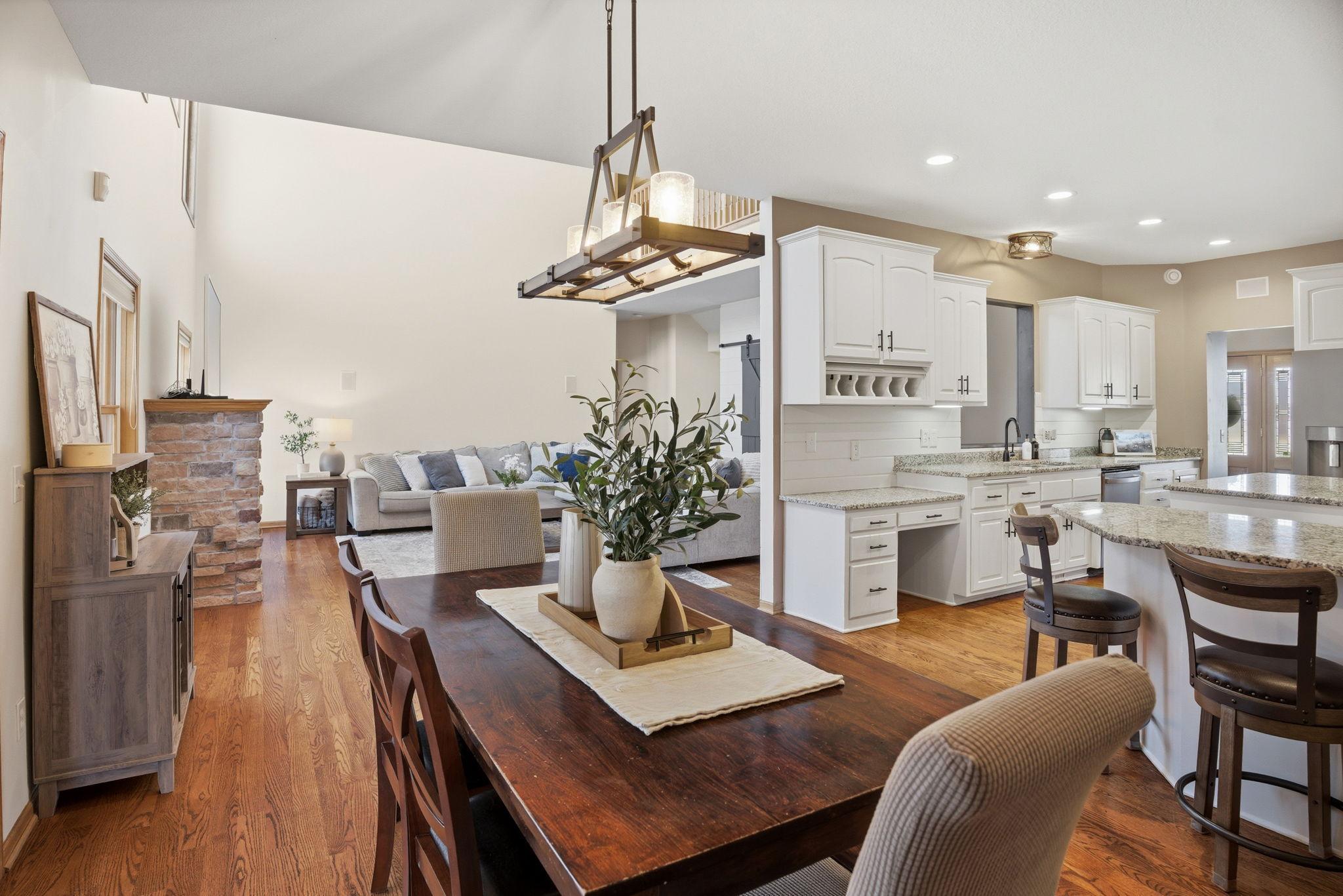 Elegant open-concept great room, dining space, and kitchen, offering a picture-perfect setting for family gatherings and entertaining.